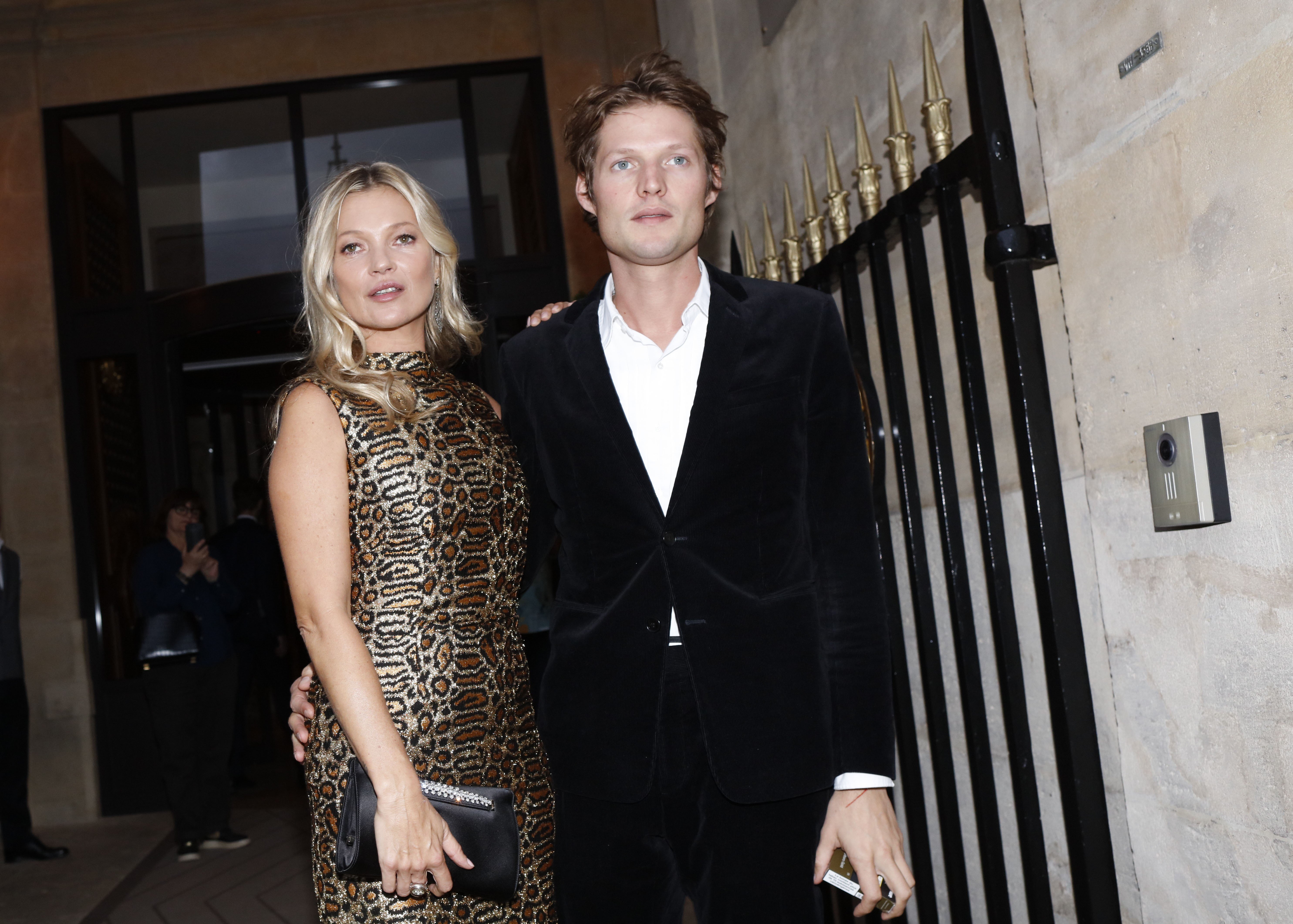 Kate Moss, who is older than her boyfriend Nikolai von Bismarck, pose for a photo together outside The Hotel De Crillon