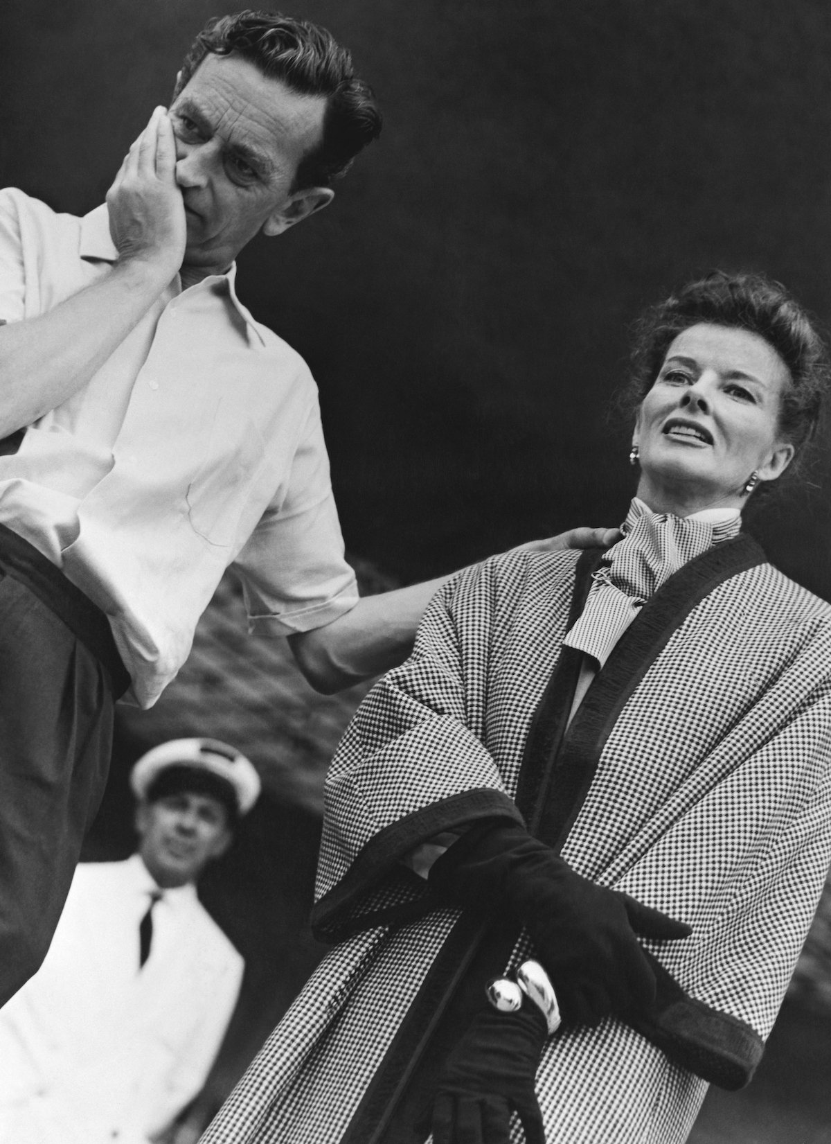 David Lean holds his chin and Katharein Hepburn's shoulder on the set of 'Summertime'