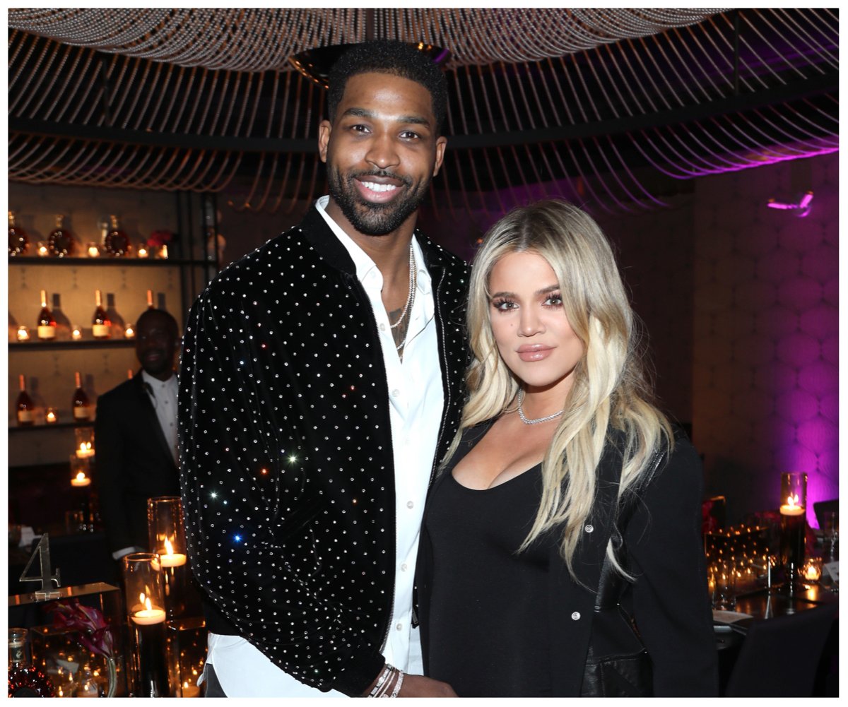 Tristan Thompson and Khloé Kardashian, who are expecting their second baby together via surrogate, smile and pose together at an event.