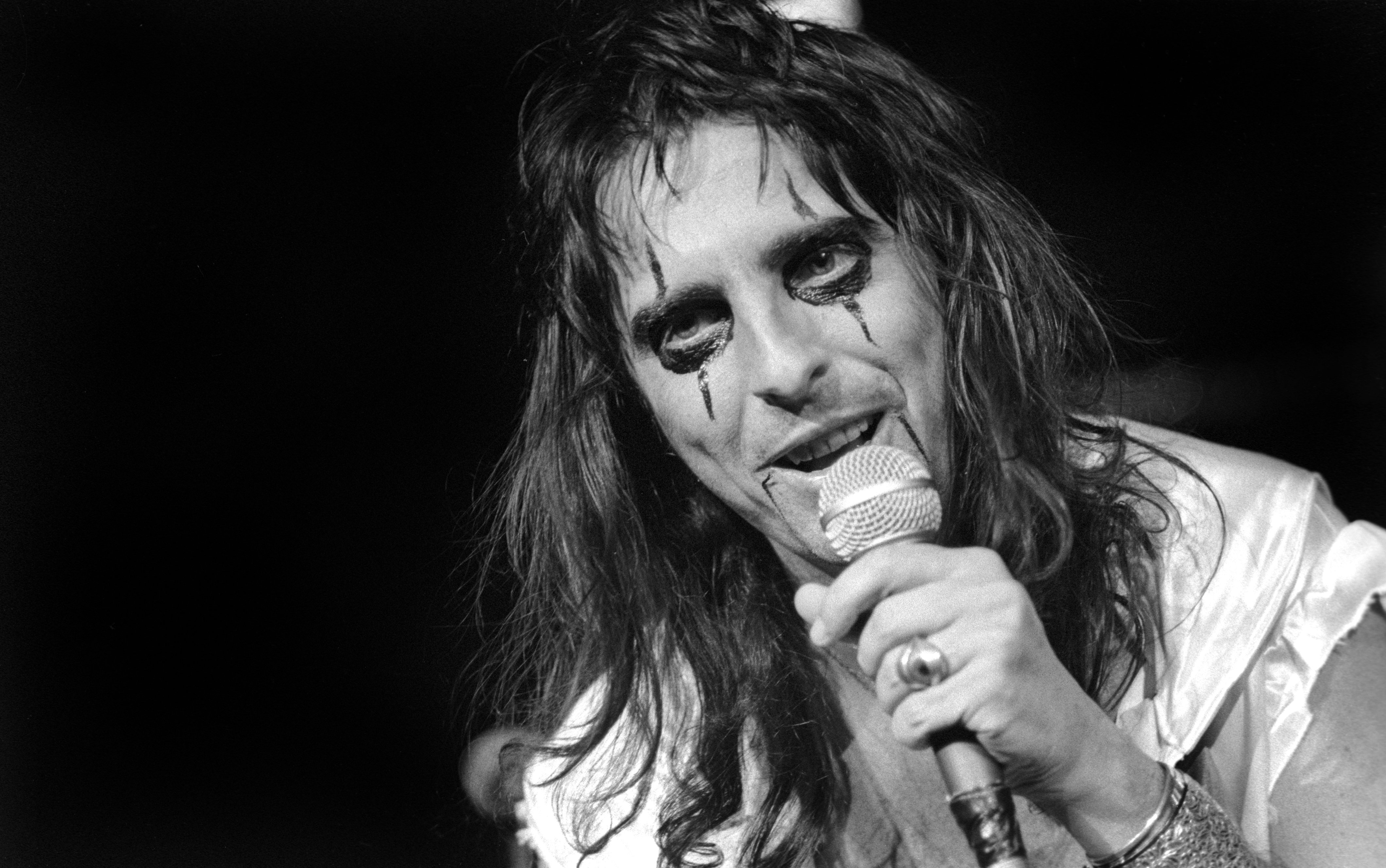Alice Cooper holding a microphone