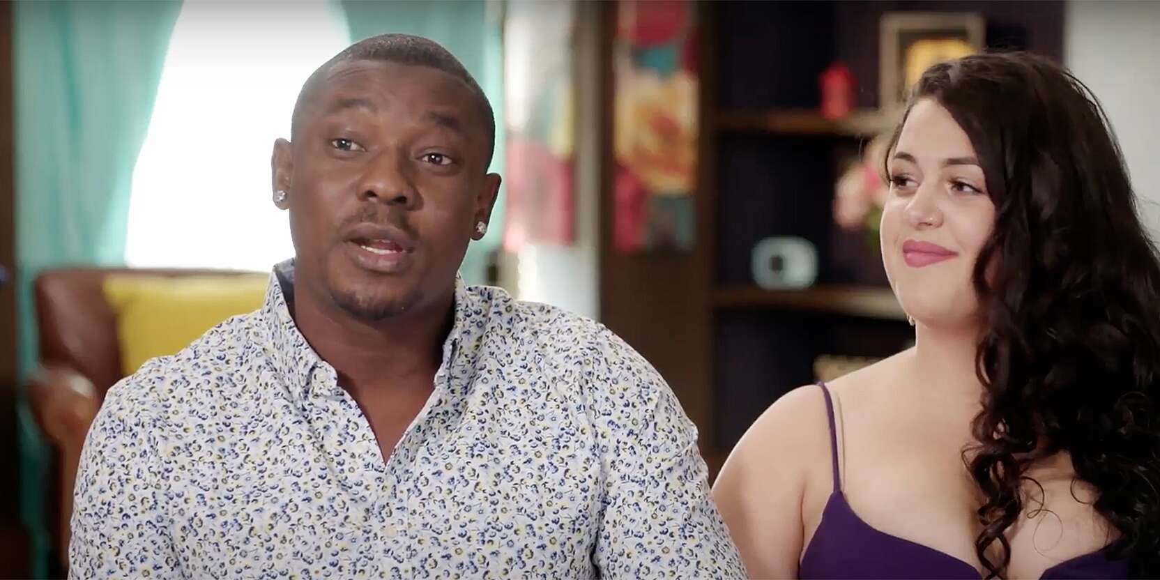 Kobe and Emily sitting together on a couch for an interview for '90 Day Fiancé' Season 9 on TLC.