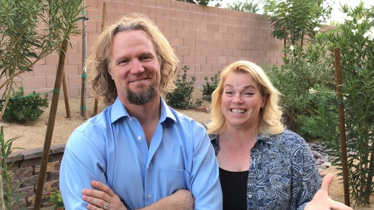 Kody Brown standing beside second wife, Janelle Brown in her back yard on 'Sister Wives' on TLC.