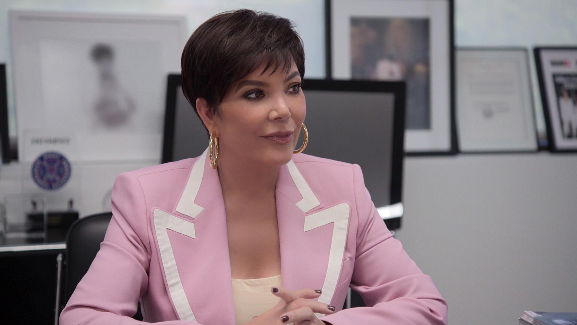 Kris Jenner wearing a pink jacket in an episode of 'The Kardashians'