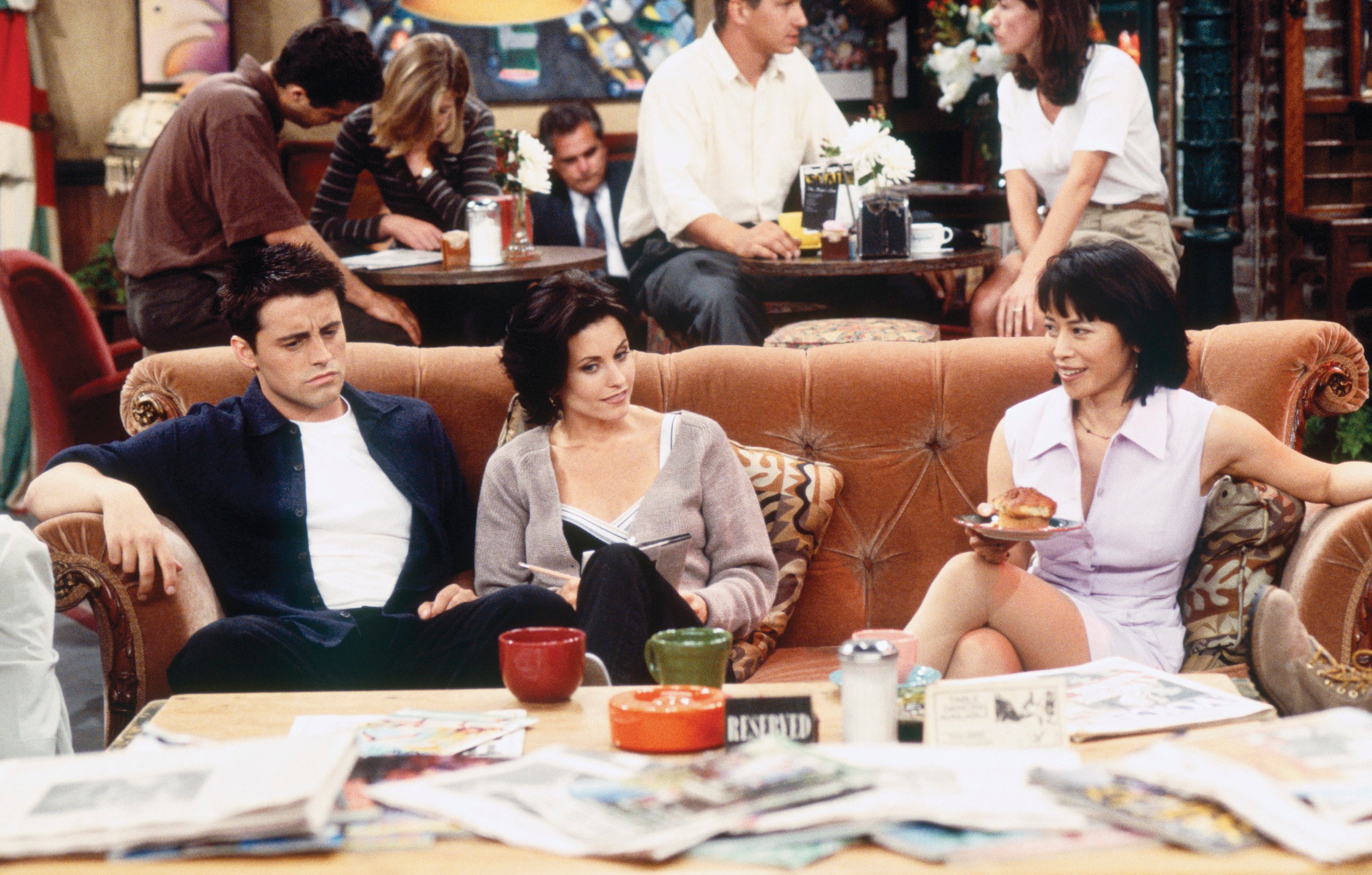 Joey, Monica and Julie sit in 'Central Perk'
