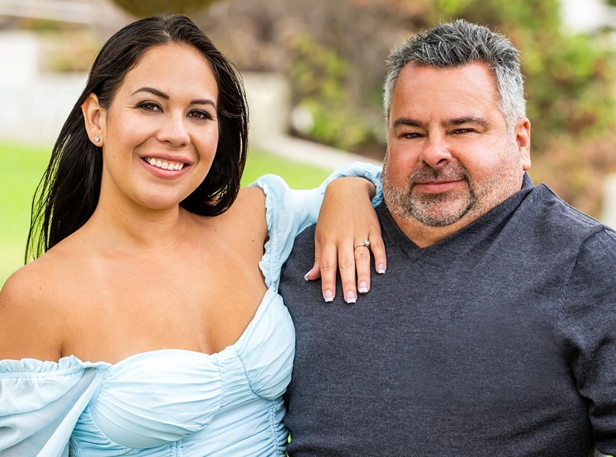 Liz Woods and Big Ed Brown stand together for a promo photo for '90 Day Fiancé: Happily Ever After?' Season 7.
