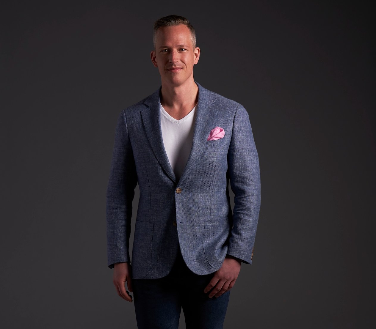 Jeremy Hartwell poses in a white shirt and blue blazer for 'Love Is Blind'.