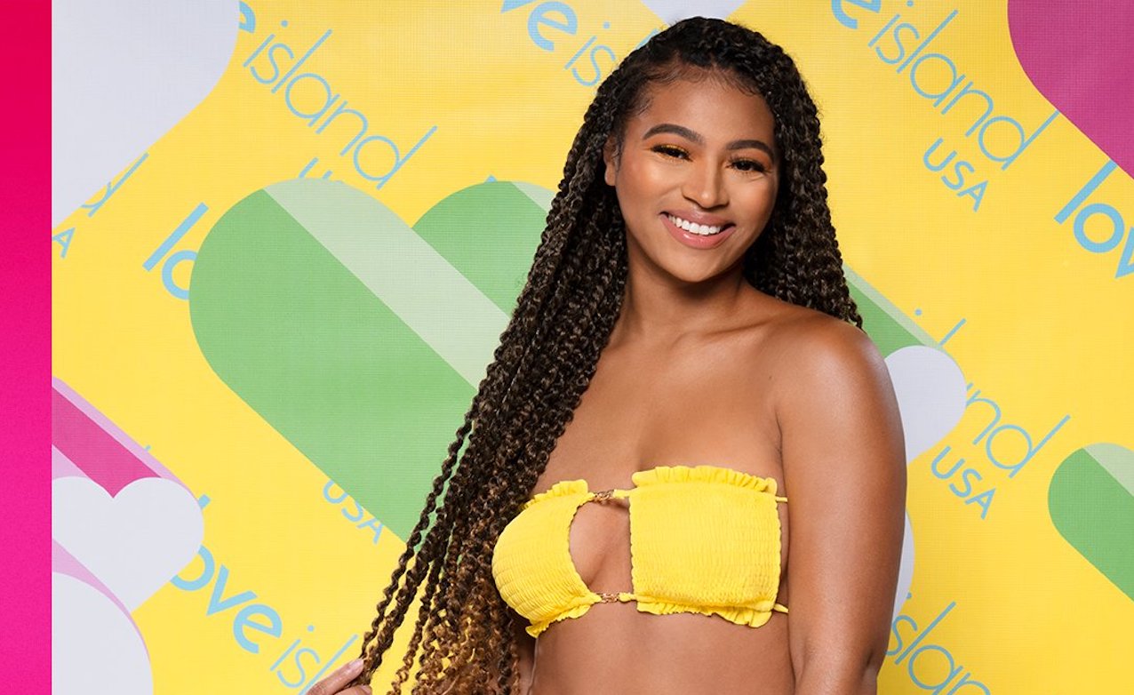 Bria Bryant smiles in a yellow bikini on 'Love Island: USA'