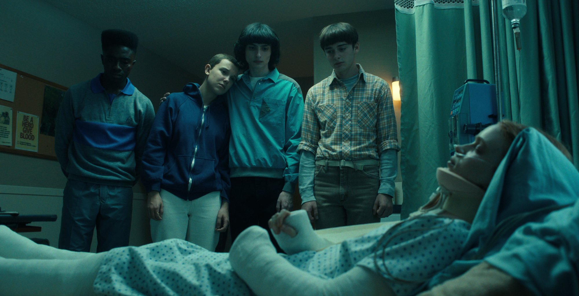 Lucas, Eleven, Mike and Will looking at Max in hospital in 'Stranger Things' 4 Volume 2.