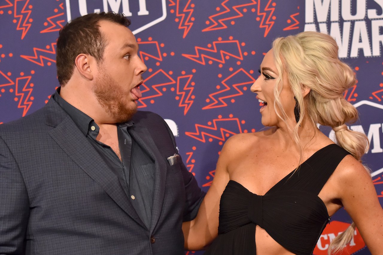 Luke Combs, pictured with his wife Nicole, has been spending more days at home with his son 'little Tex'