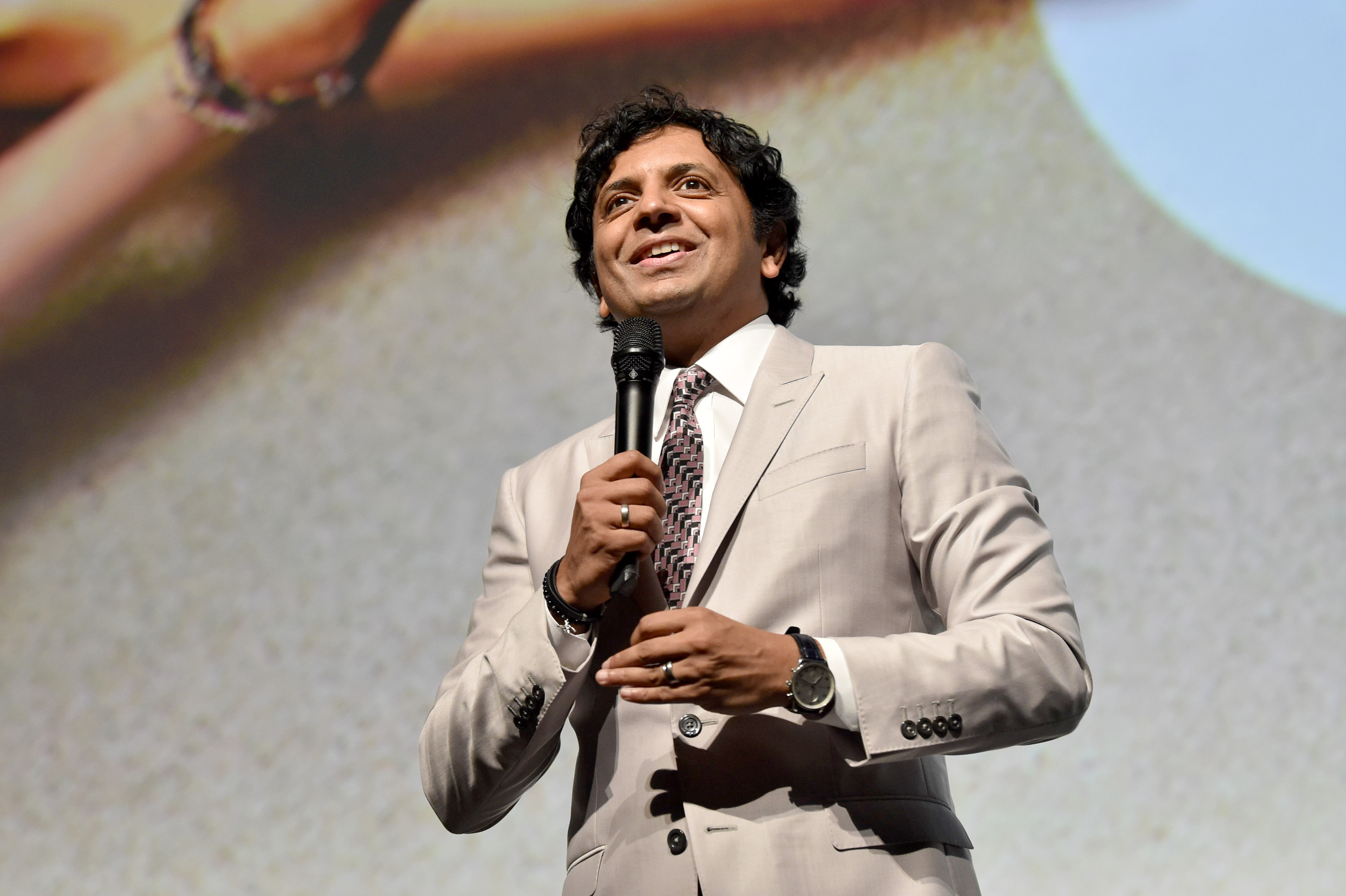 Director M. Night Shyamalan attends the premiere of his horror movie Old
