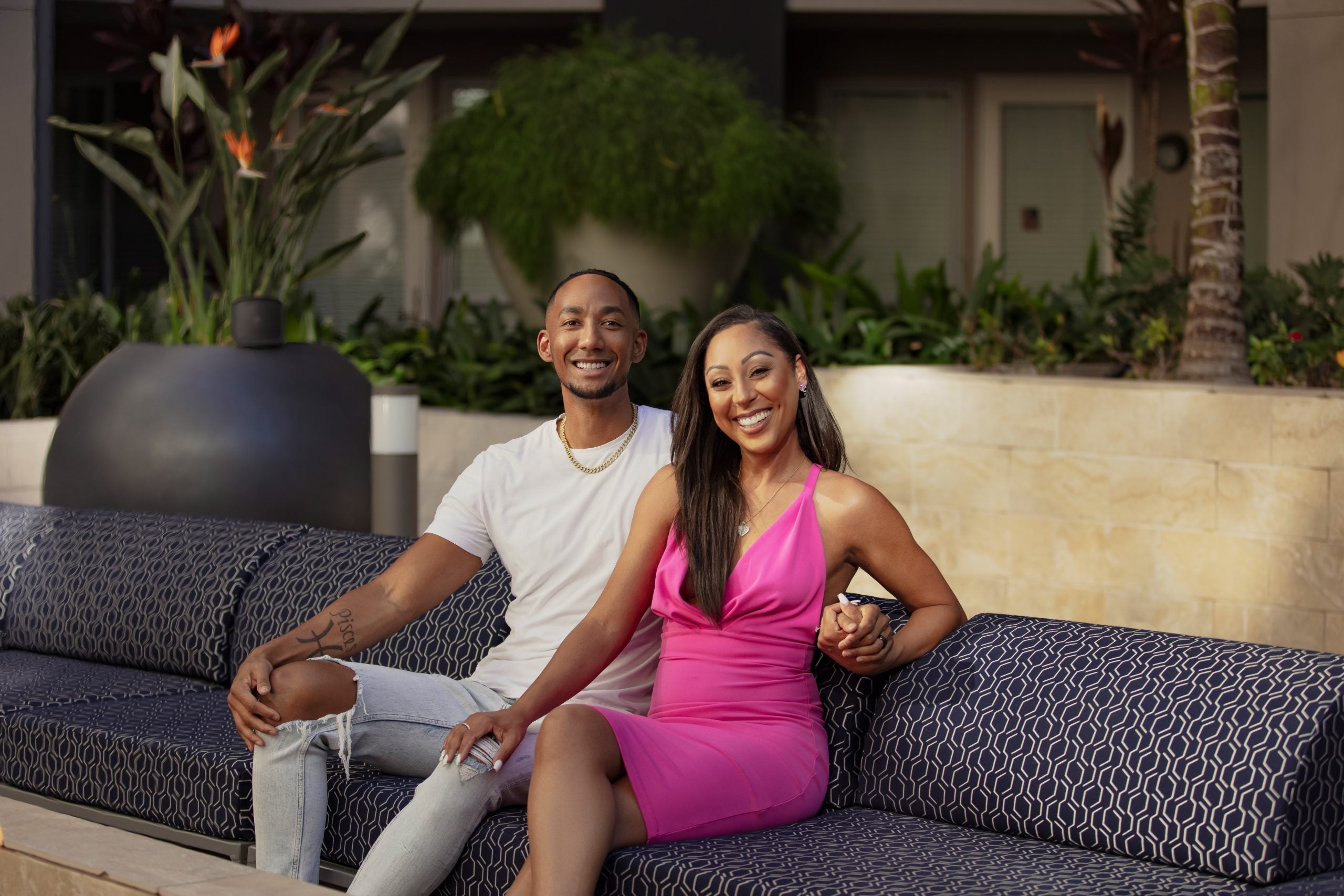 Nate and Stacia from 'Married at First Sight' Season 15 sitting on a bench outside