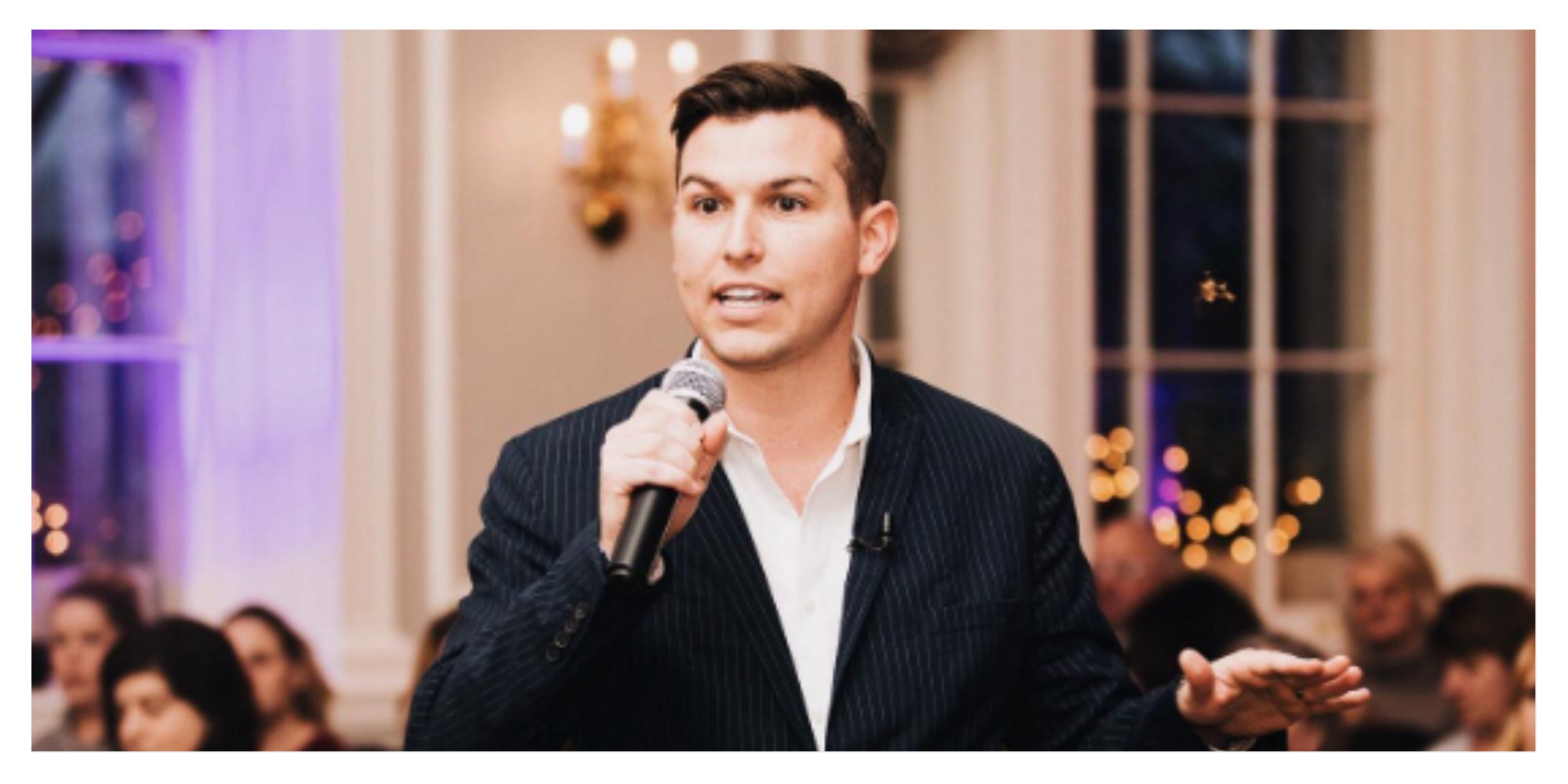 Matt Fraser speaks to a crowd during a live show 