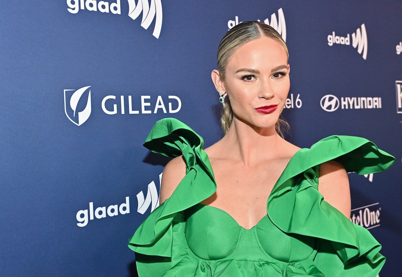 Meghan O'Toole King wearing a green dress on the red carpet at an event