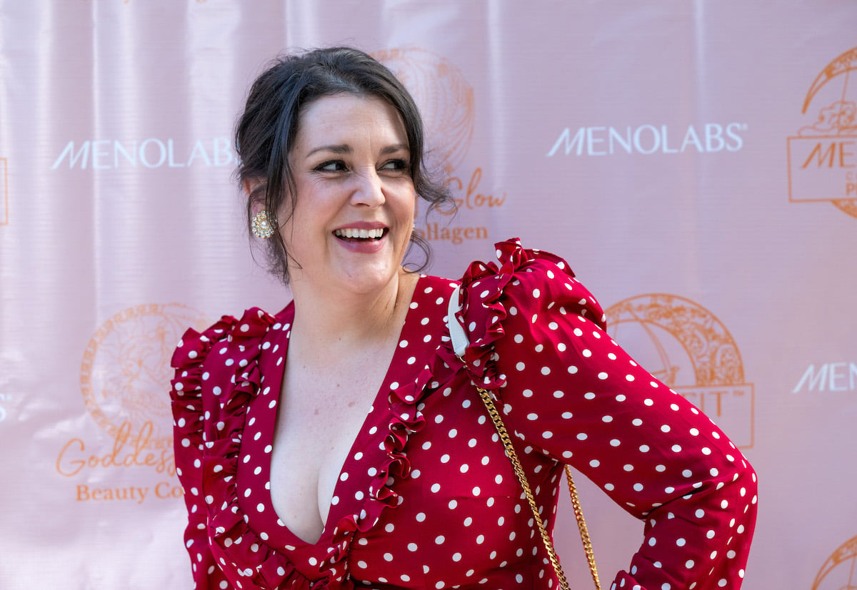 Actress Melanie Lynskey laughs in front of the cameras in 2022