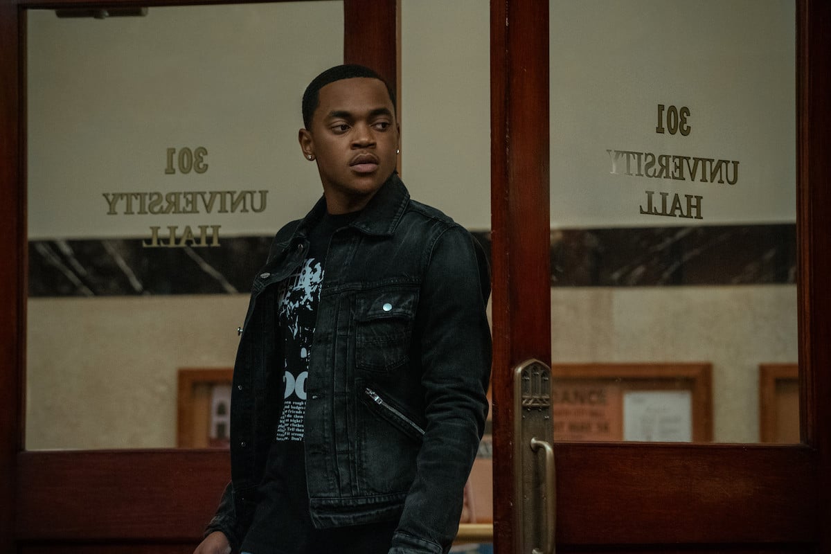 Michael Rainey Jr. as Tariq St. Patrick wearing a jean jack and standing in a classroom in 'Power Book II: Ghost'