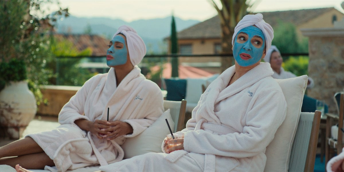 Michaela Jaé Rodriguez and Maya Rudolph in 'Loot' Season 1 Episode 5: 'Halsa' wearing robes and face masks