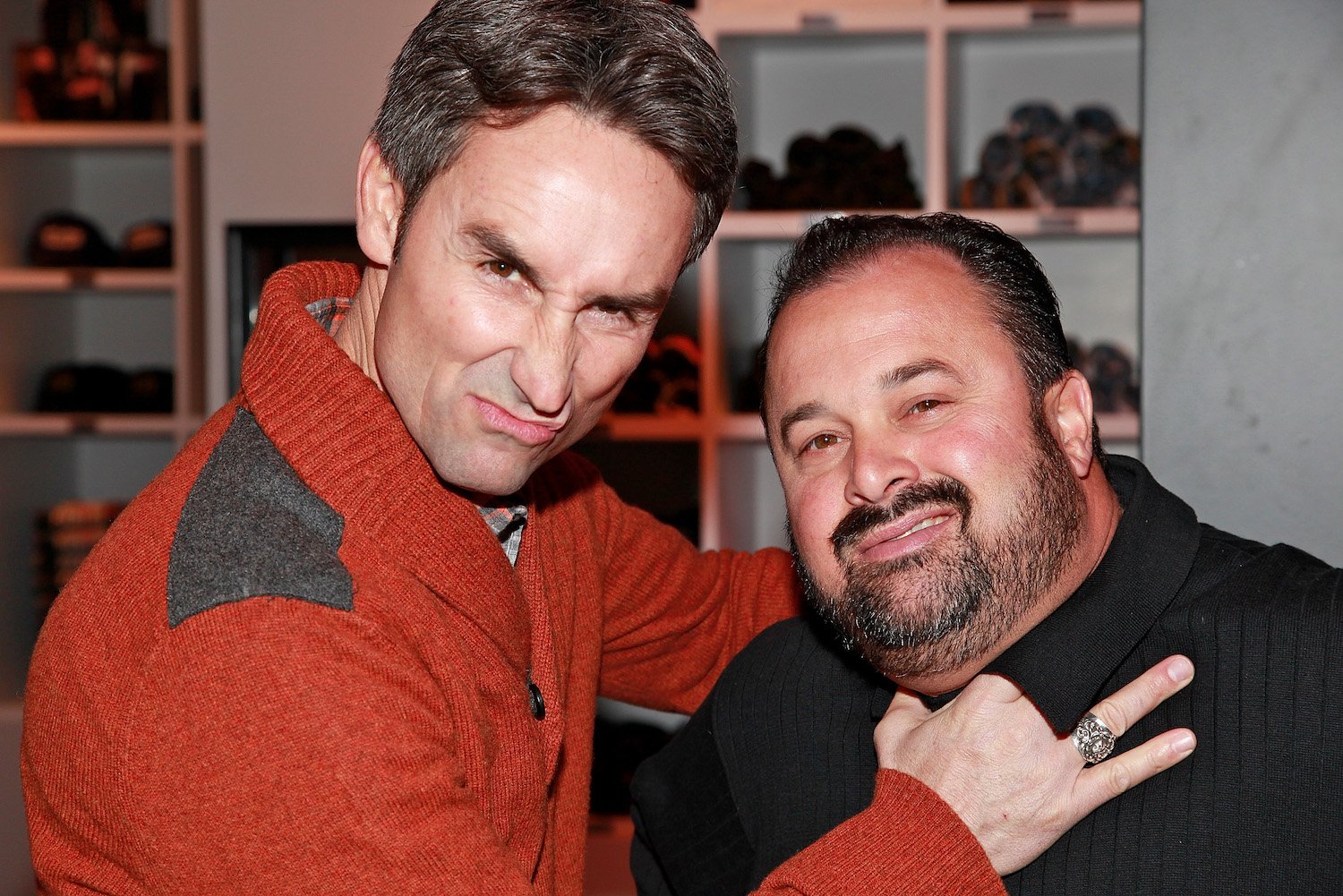 Mike Wolfe and Frank Fritz playfully smiling together from 'American Pickers'