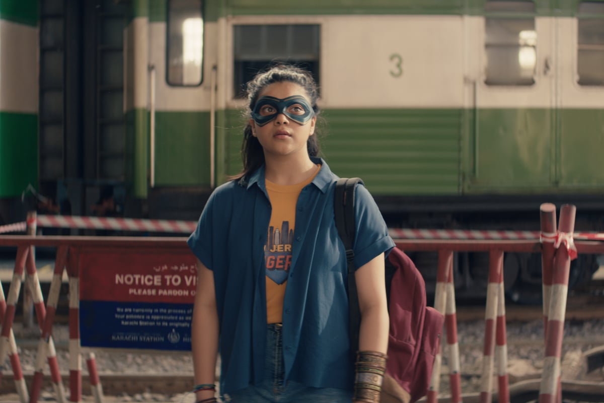 'Ms Marvel': Kamala Khan (Iman Vellani) wears a mask standing in front of trailers