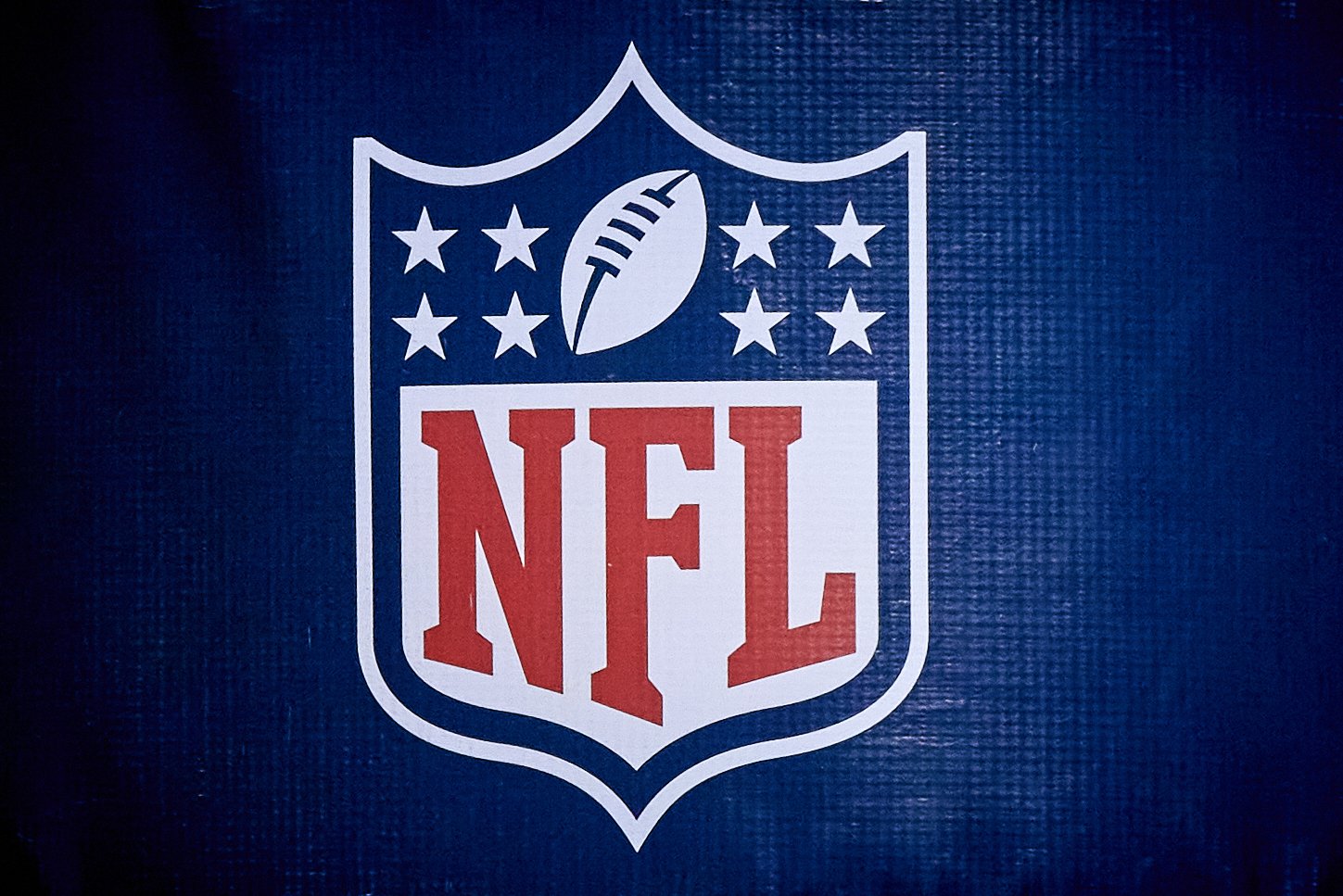 A detailed view of the NFL crest logo on a goal post