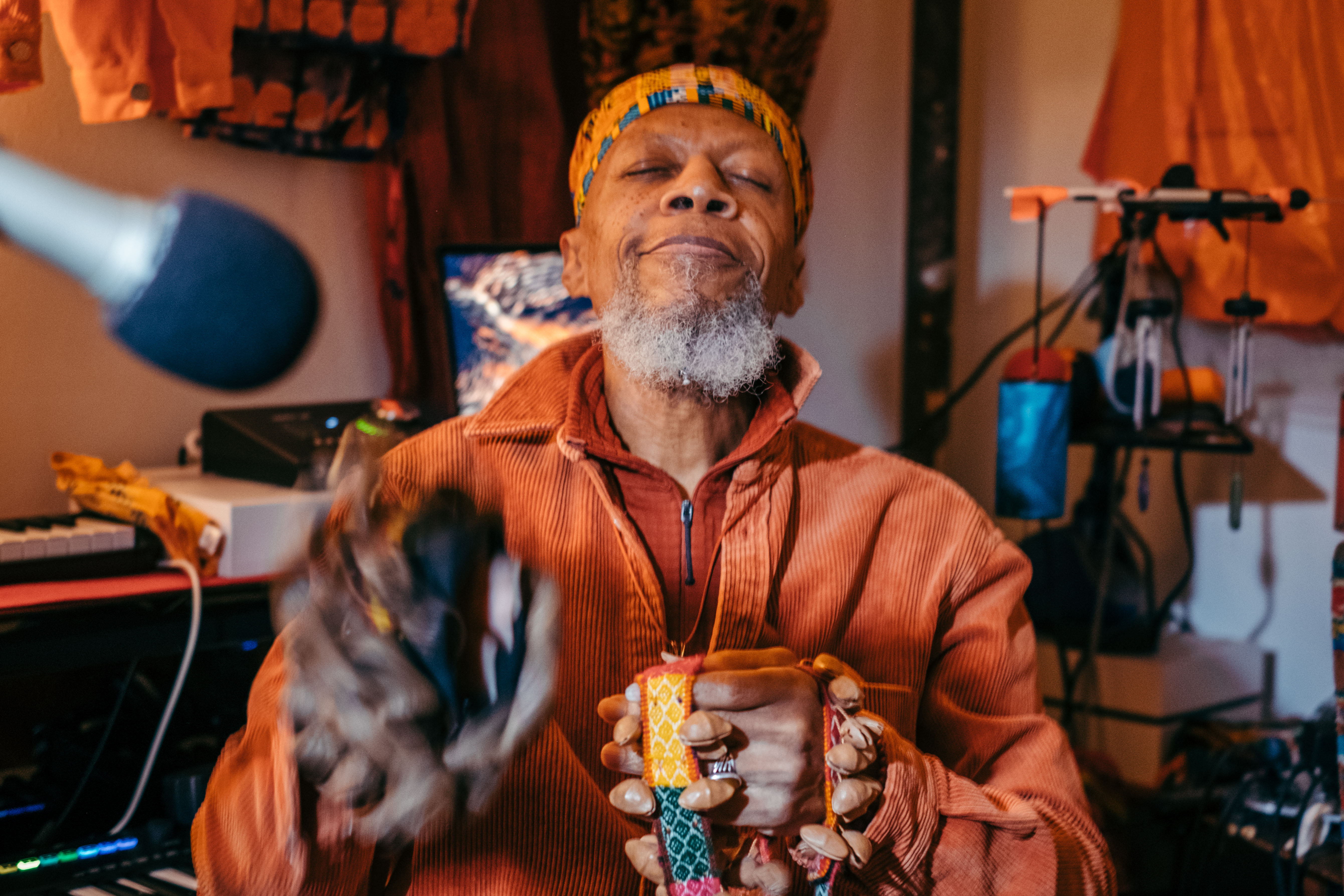 Multi-instrumentalist Edward Larry Gordon, known by his stage name Laraaji, plays Peruvian cacho seed pods