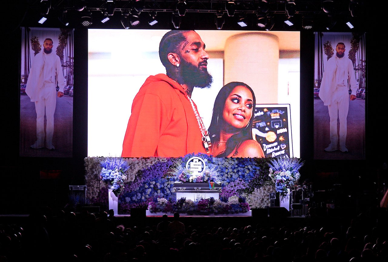 Image of Nipsey Hussle and Lauren London at the rapper's memorial; London says Diddy helped her show up at Hussle's funeral
