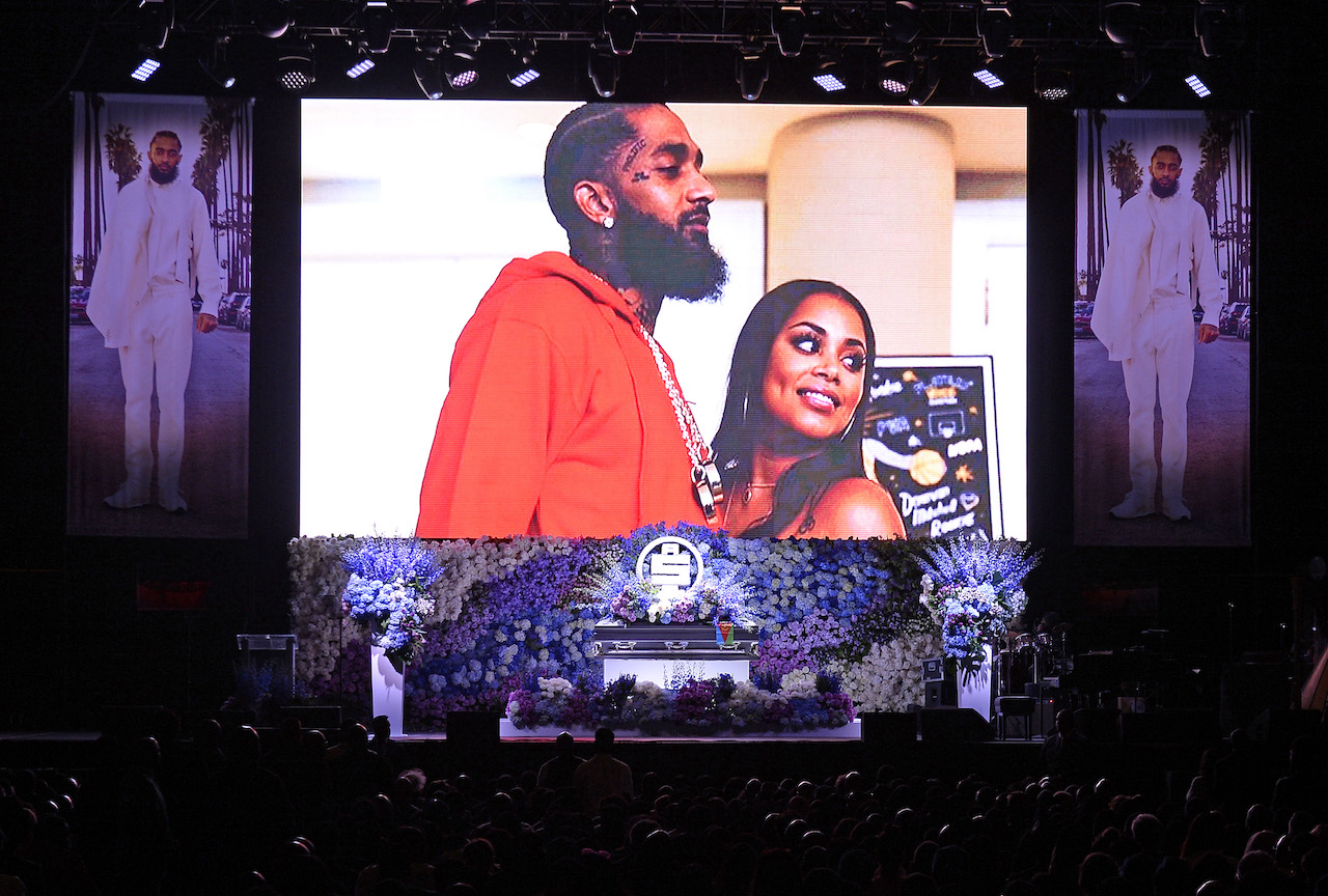 Image of Nipsey Hussle and Lauren London at the rapper's memorial; London says Diddy helped her show up at Hussle's funeral