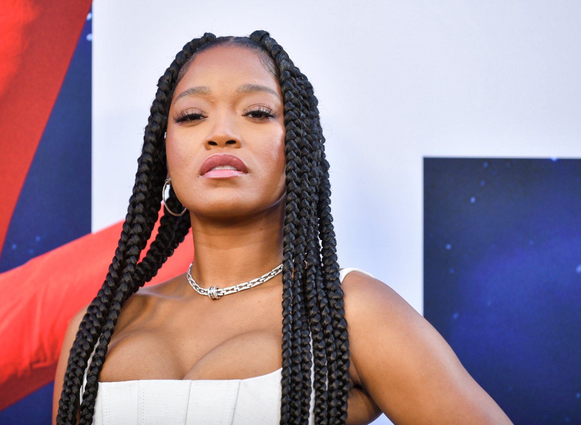 'Nope' Keke Palmer wearing a white top posing for press photos