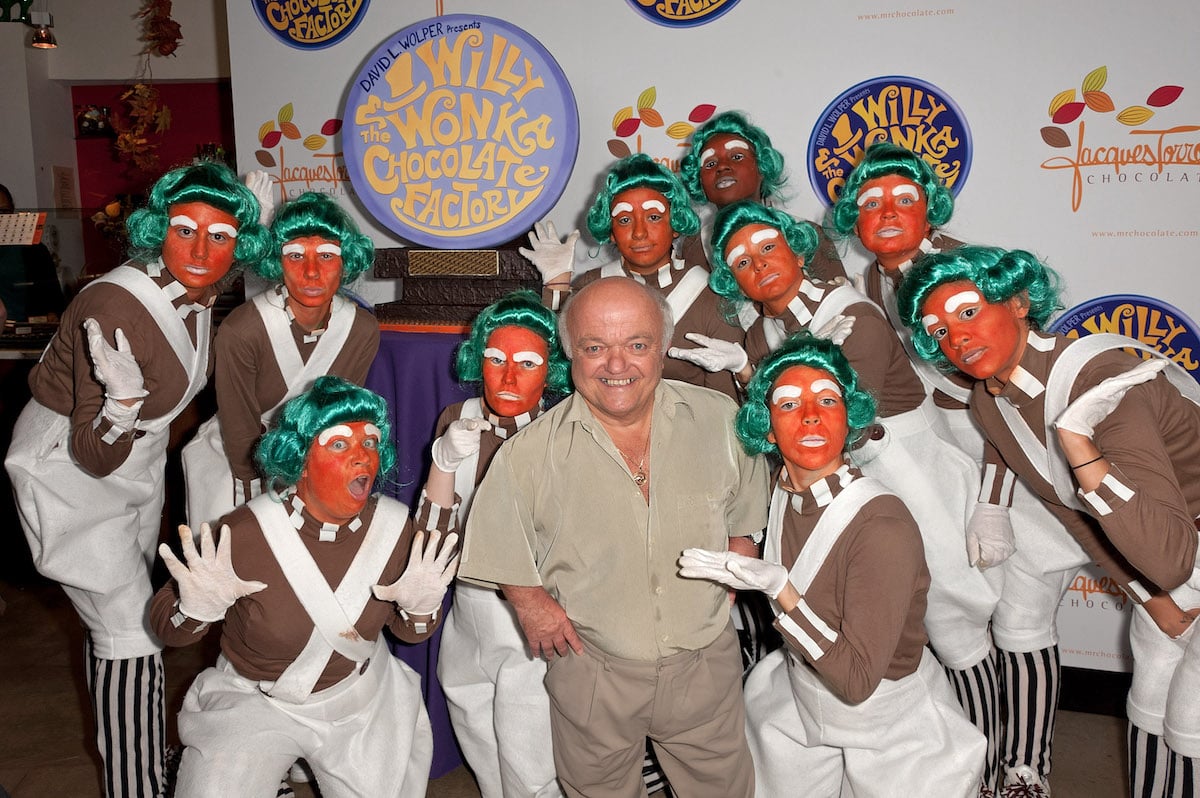 Actor Rusty Goffe poses with Oompa Loompas at the 40th anniversary of Willy Wonka & the Chocolate Factory