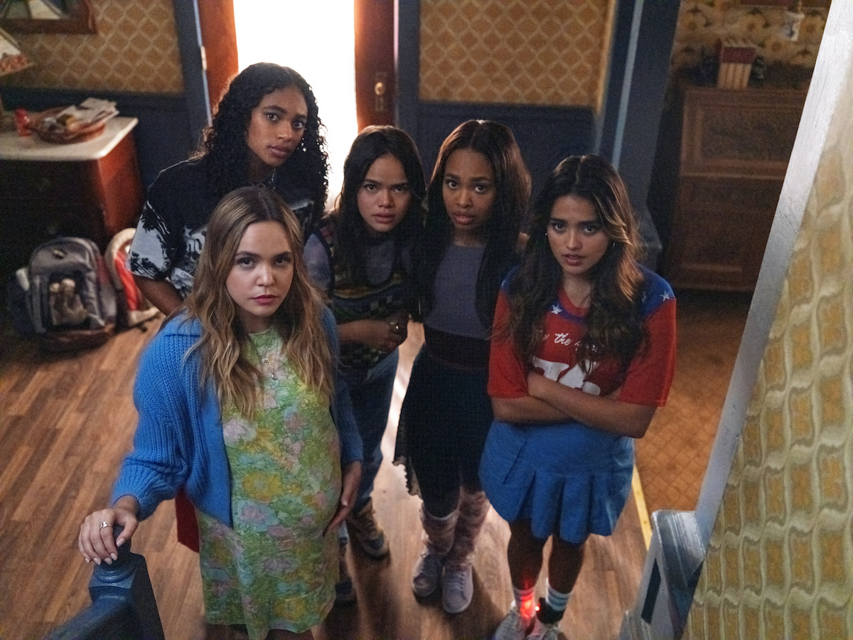 'Pretty Little Liars Original Sin' cast members at the foot of a staircase