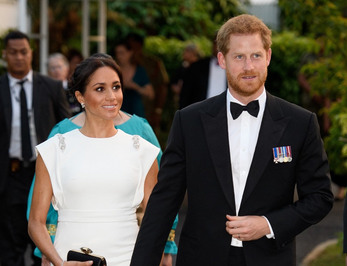 Prince Harry, whose friends were "disappointed" when they met his future bride, attending an engagement during their visit to Australia, Fiji, Tonga, and New Zealand
