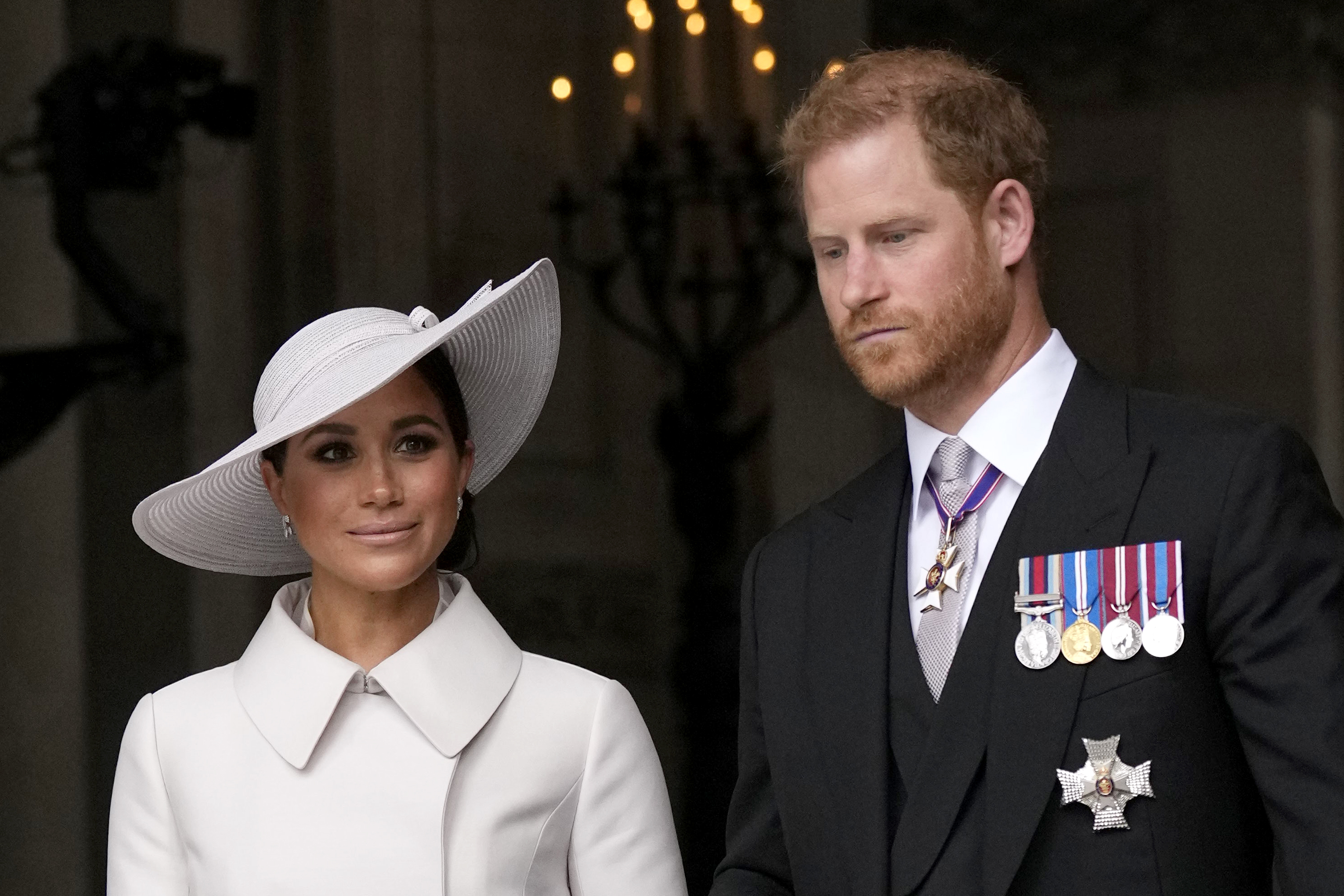 Prince Harry and Meghan Markle depart after a service of thanksgiving
