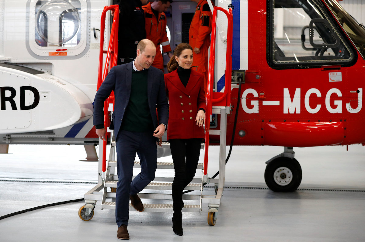 Prince William and Kate Middleton, whose helicopter use reportedly bothers Queen Elizabeth II, tour a helicopter