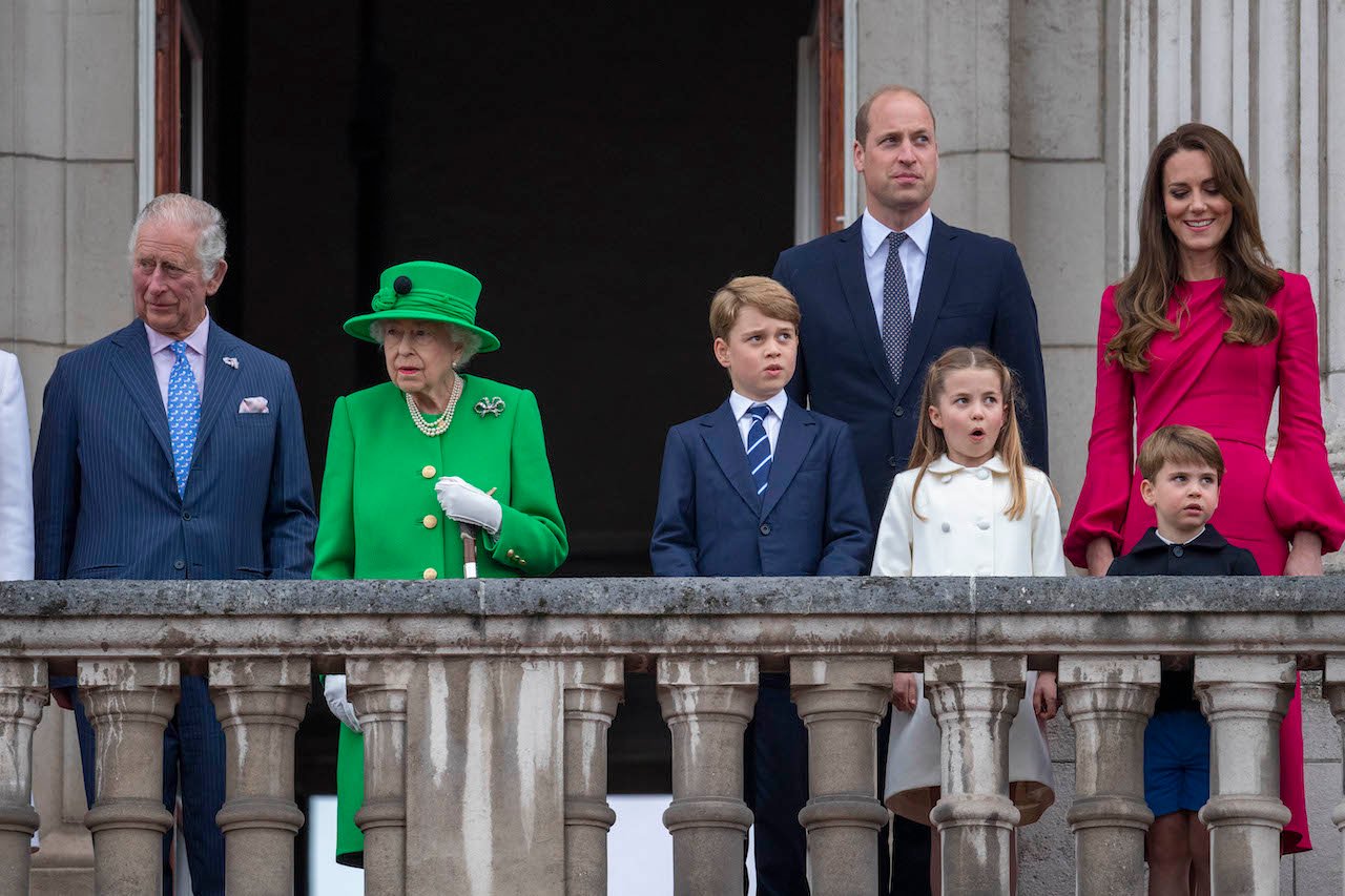 (L-R) Prince Charles, Queen Elizabeth II, Prince George, Prince William, Princess Charlotte, Prince Louis, and Kate Middleton stand on the balcony during the Platinum Pageant