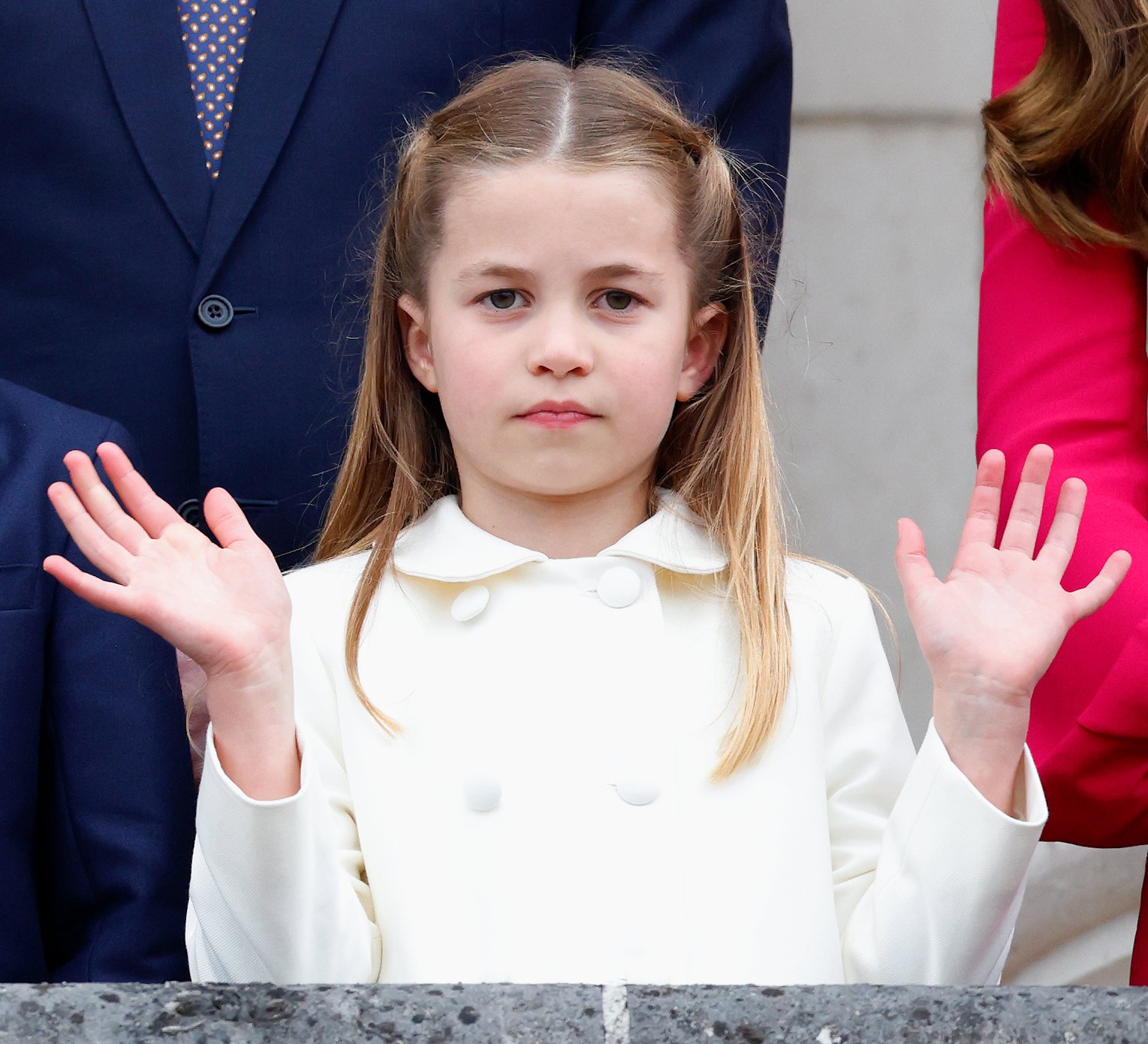 Princess Charlotte waving from the balcony of Buckingham Palace following the Platinum Pageant