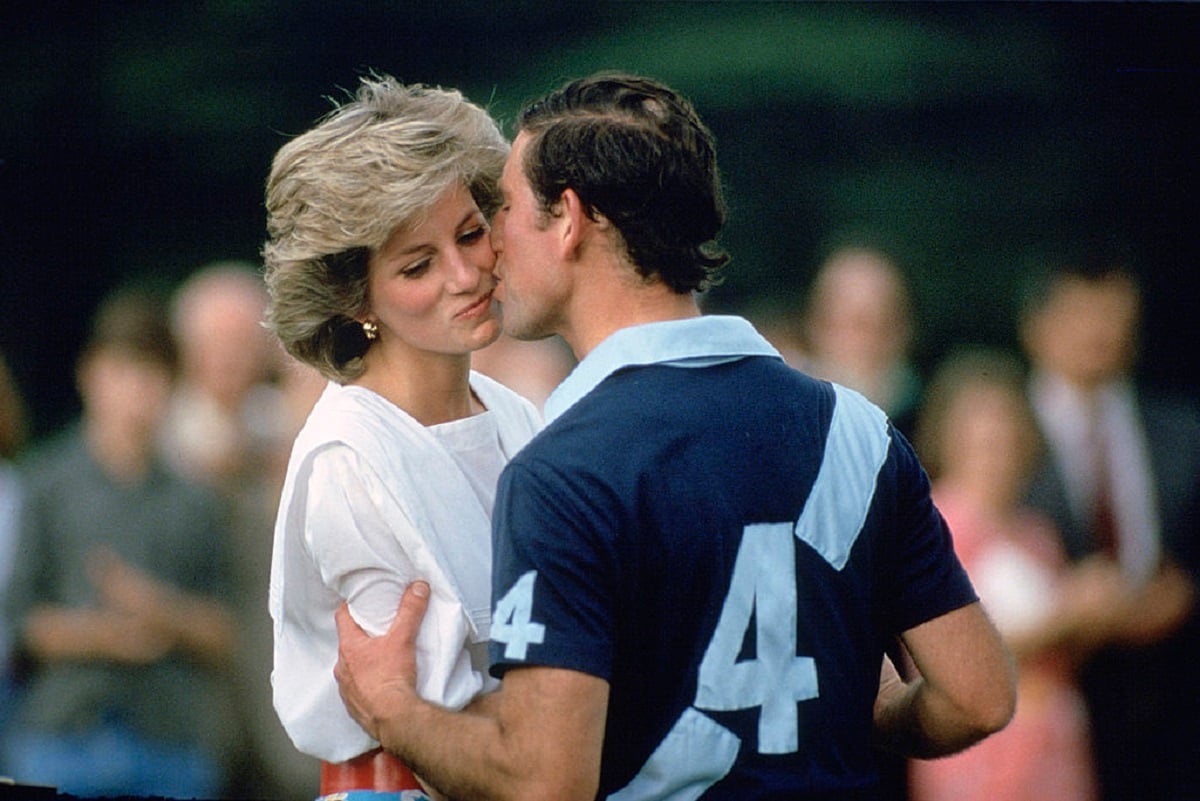 Princess Diana turning her head as Prince Charles kissed her