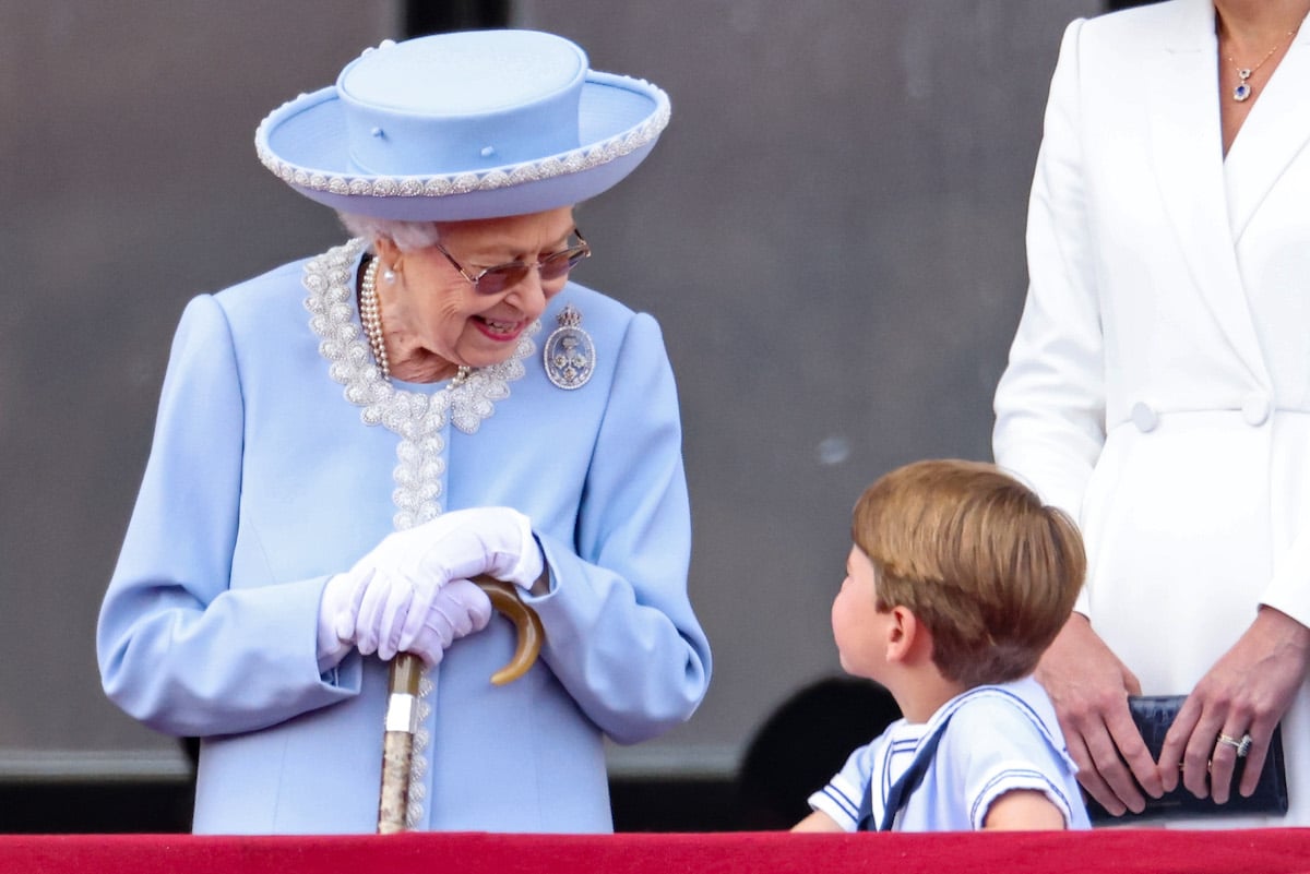 Queen Elizabeth II and Prince Louis look at each other prior to Queen Elizabeth II's conversation with Prince George on the balcony at the close of Platinum Jubilee weekend