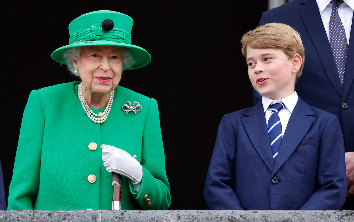 Queen Elizabeth, who a lip reader says had five words for Prince George, stands on the Buckingham Palace balcony next to Prince George at the end of Platinum Jubilee weekend