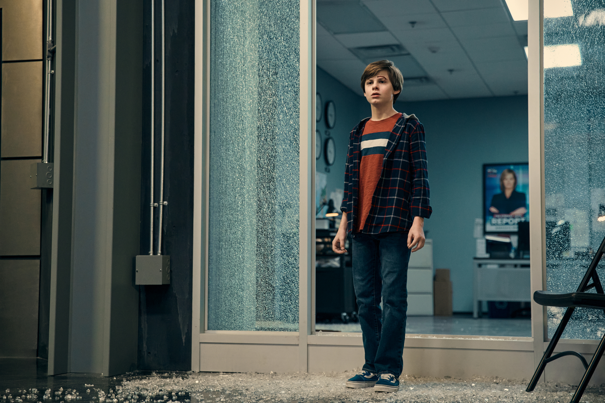 Cameron Crovetti as Ryan in 'The Boys' Season 3. He's standing in front of a broken glass wall and looks hesitant.