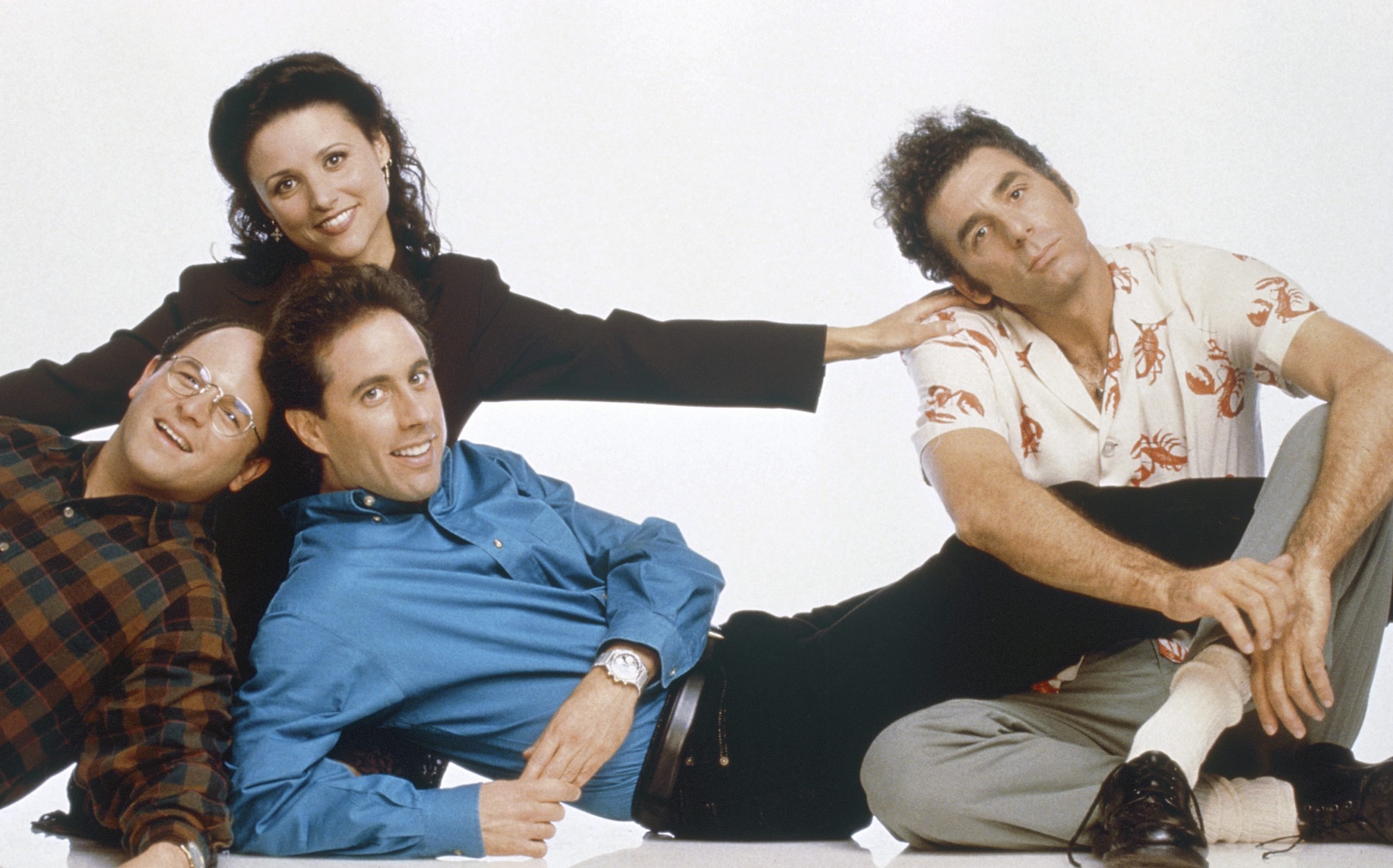 Jason Alexander as George Costanza, Jerry Seinfeld as Jerry Seinfeld, Julia Louis-Dreyfus as Elaine Benes and Michael Richards as Cosmo Kramer in a promotional photo for 'Seinfeld'