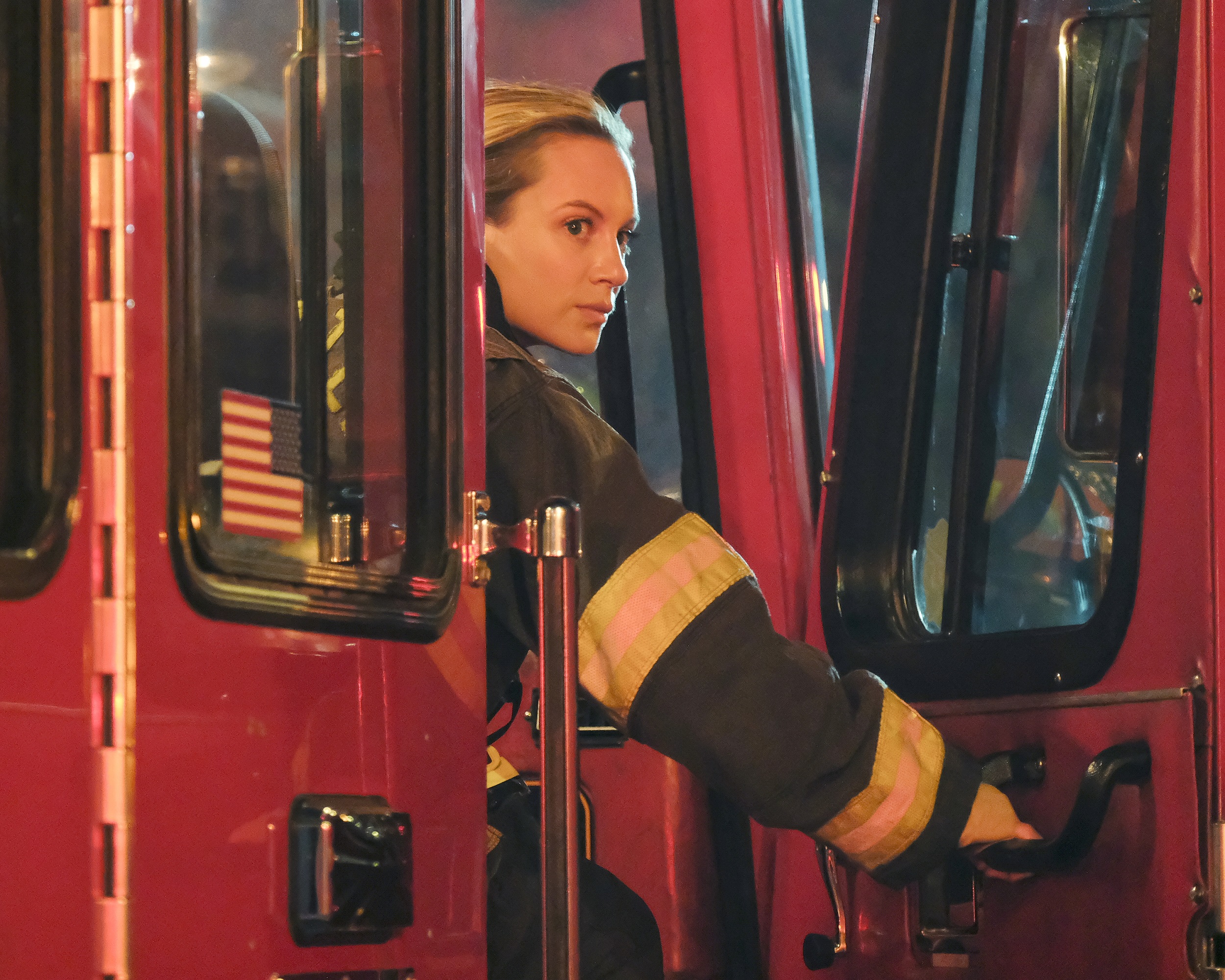 'Station 19' star Danielle Savre as Maya Bishop looking out the door of a fire engine