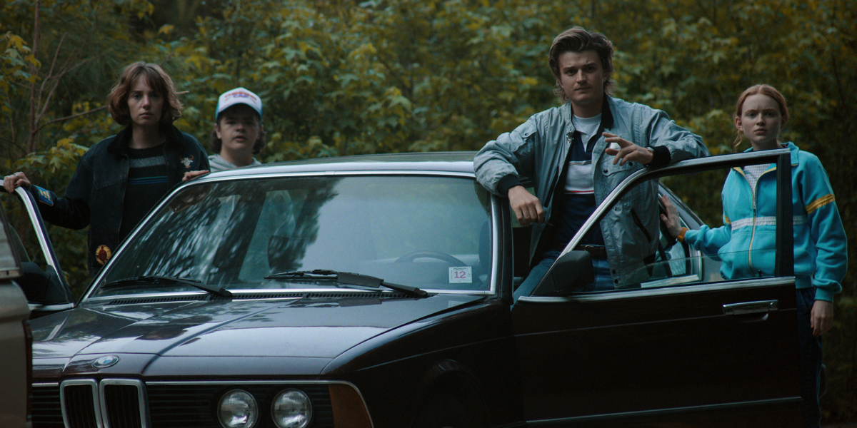 Steve, Robin, Dustin, and Max get out of the car in Stranger Things Season 4.