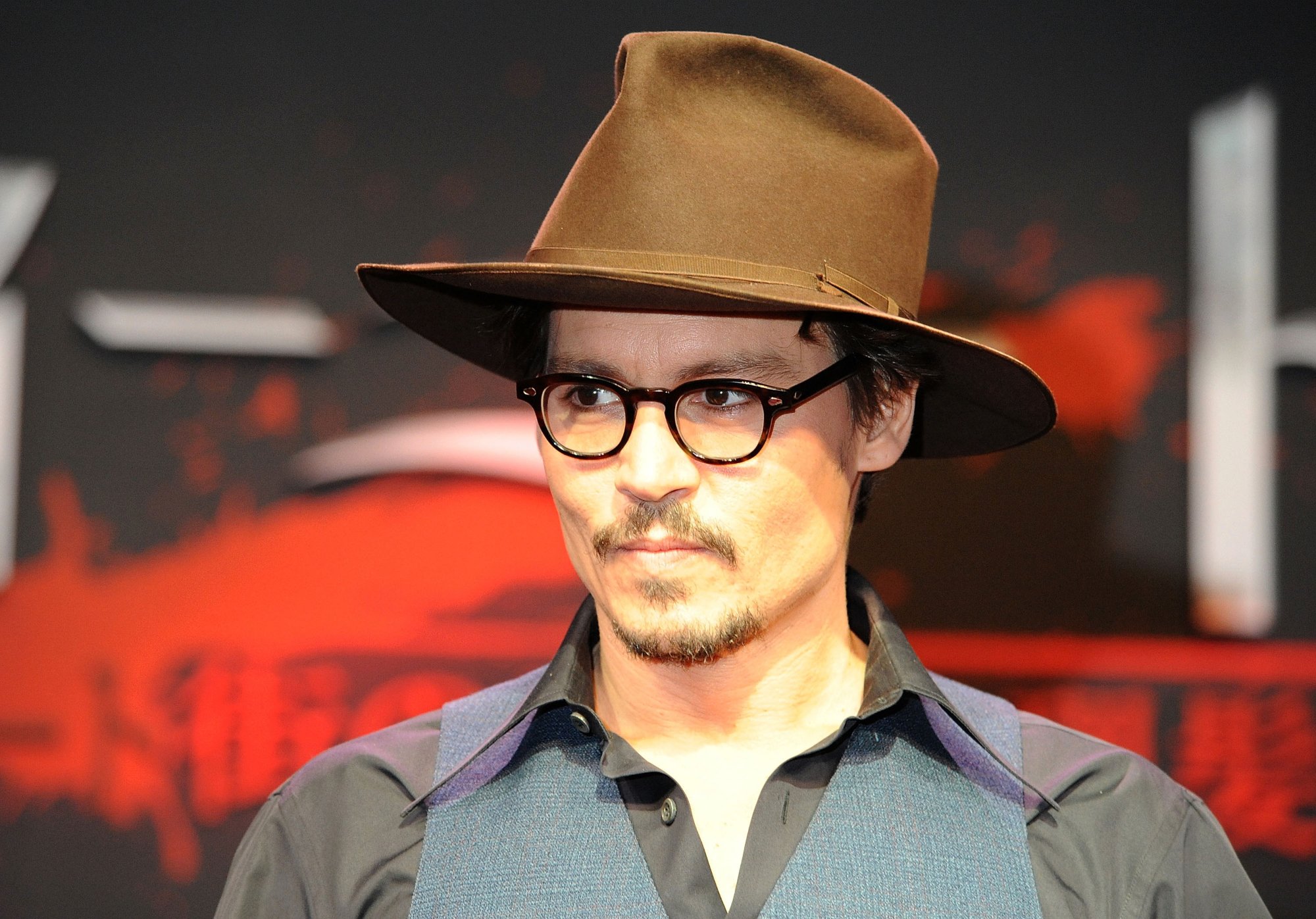 'Sweeney Todd' actor Johnny Depp wearing a hat, glasses, and a vest