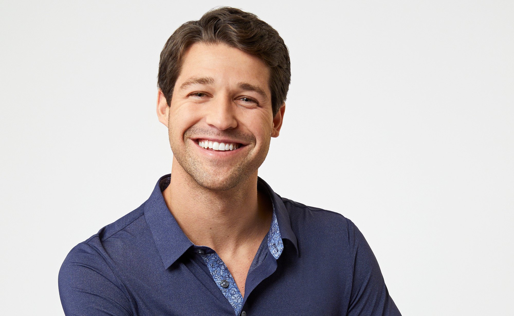 'The Bachelorette' 2022 contestant Hayden Markowitz wearing a navy collared shirt.