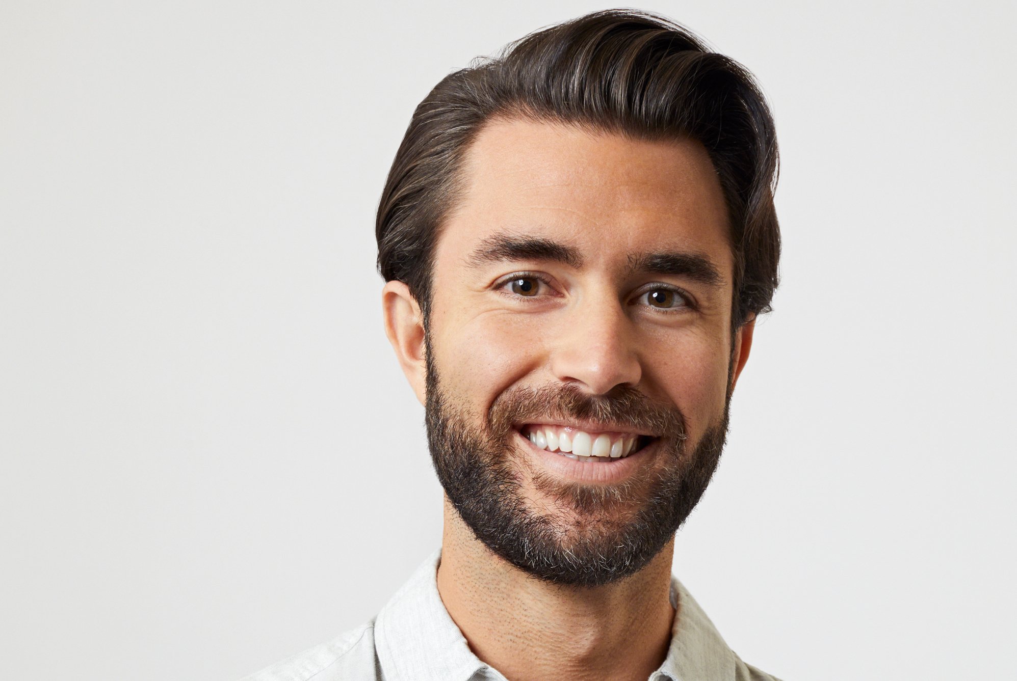 'The Bachelorette' features Justin B., seen here wearing a white collared shirt.