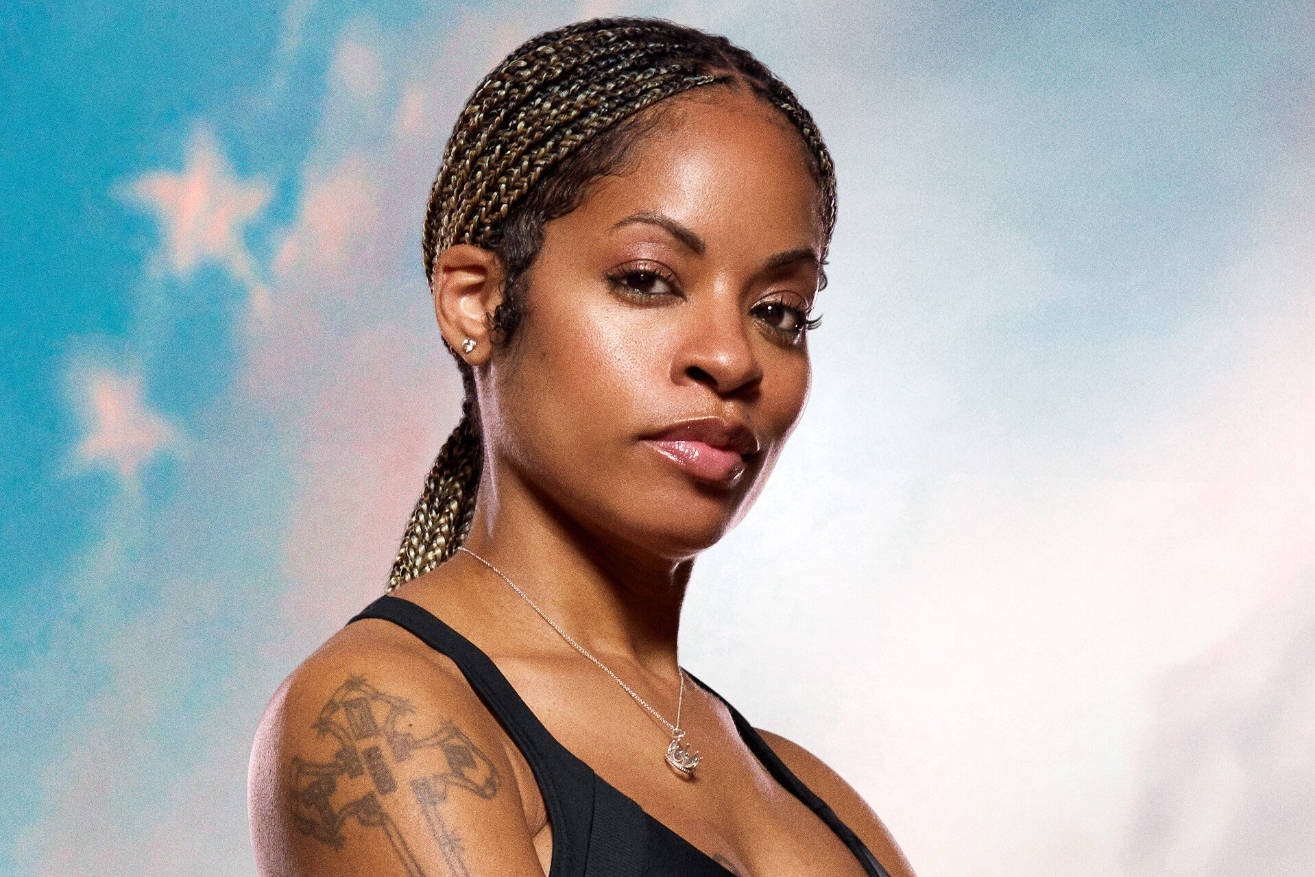 Tiffany Mitchell, a contestant on 'The Challenge: USA,' poses for promotional pictures for the show. She wears a black tank top.