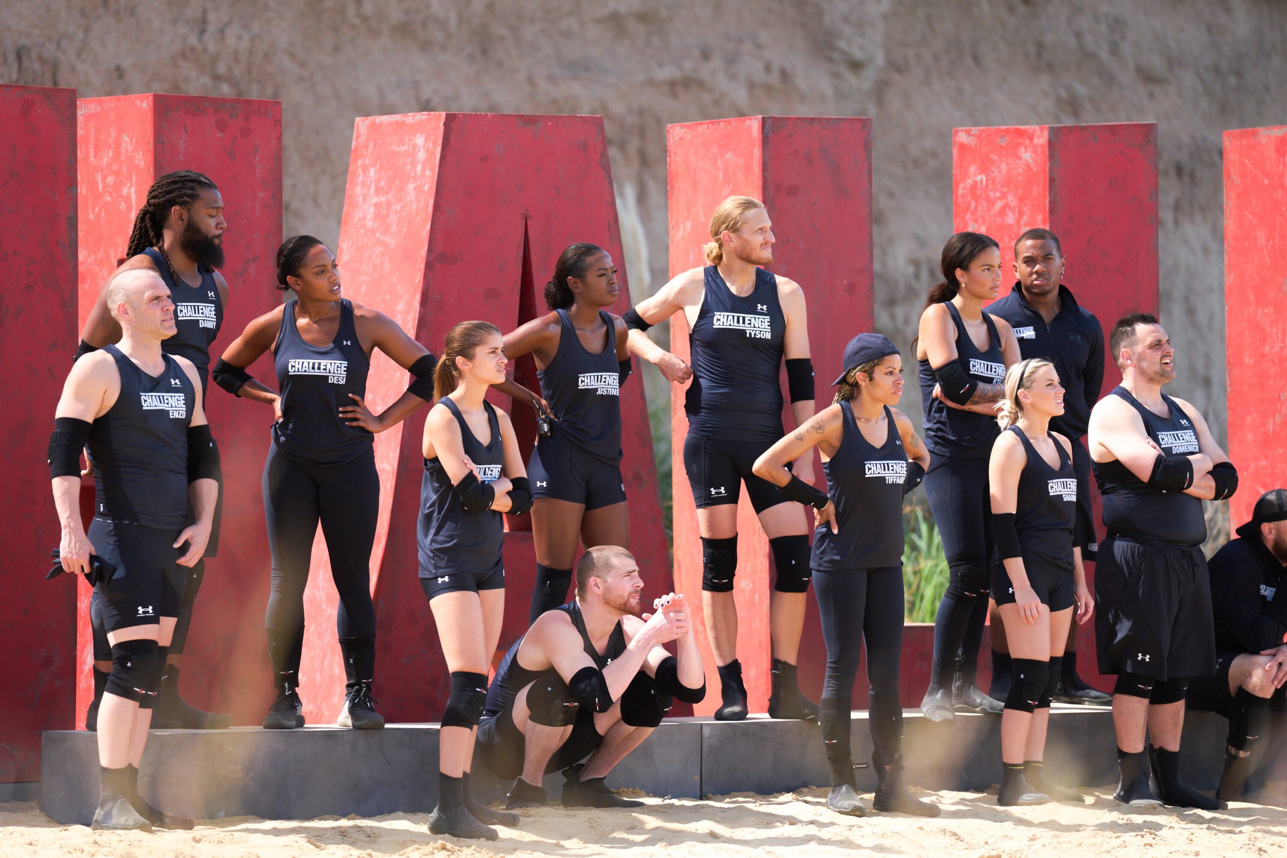 Enzo Palumbo, Danny McCray, Desi Williams, Alyssa Lopez, Cashel Barnett, Justine Ndiba, Tyson Apostol, Tiffany Mitchell, Kyra Green, Shannon St. Clair, David Alexander, and Domenick Abbate standing together during 'The Challenge: USA' challenge