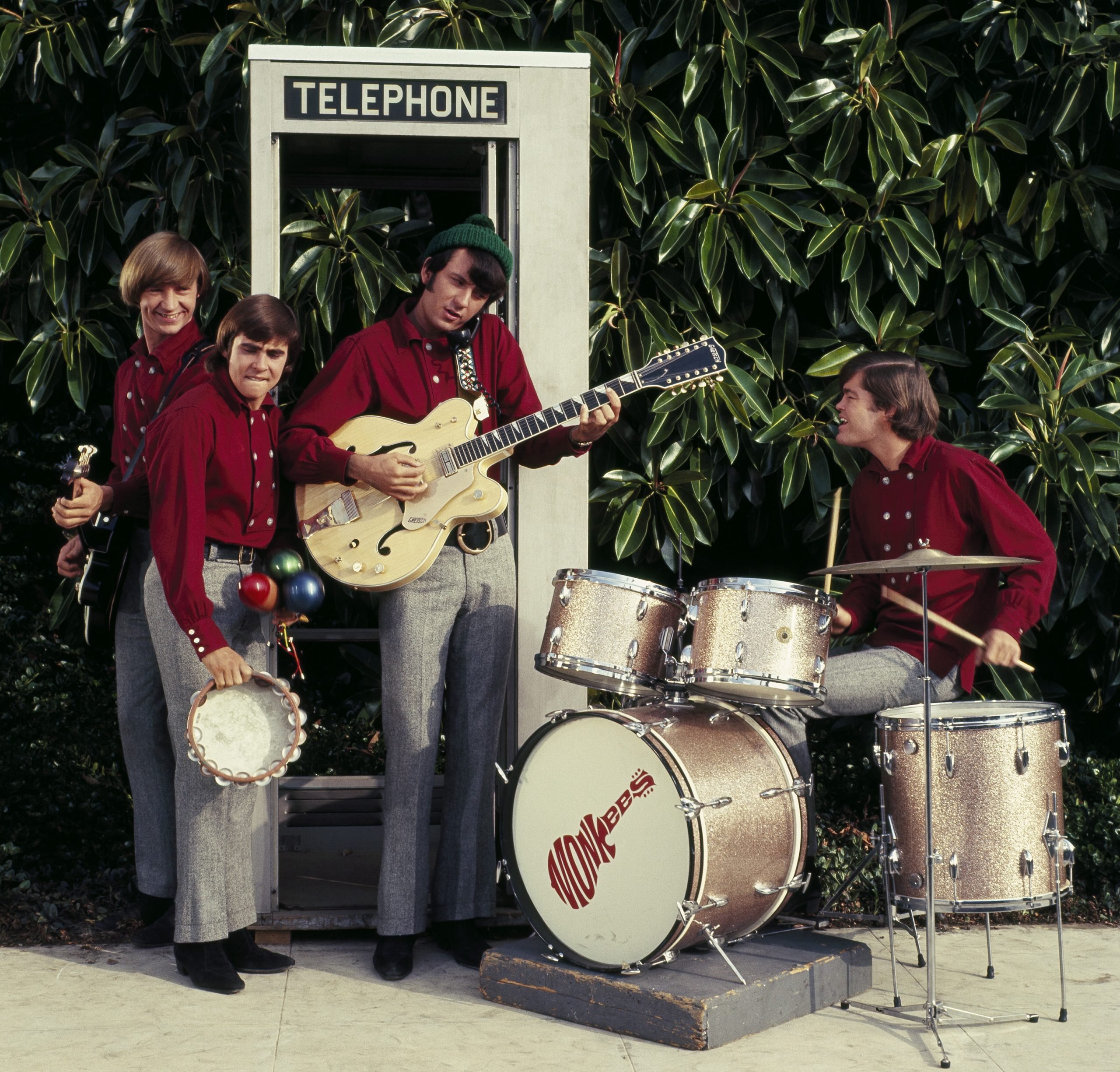The Monkees’ Peter Tork, Davy Jones, Mike Nesmith, and Micky Dolenz with a drum set