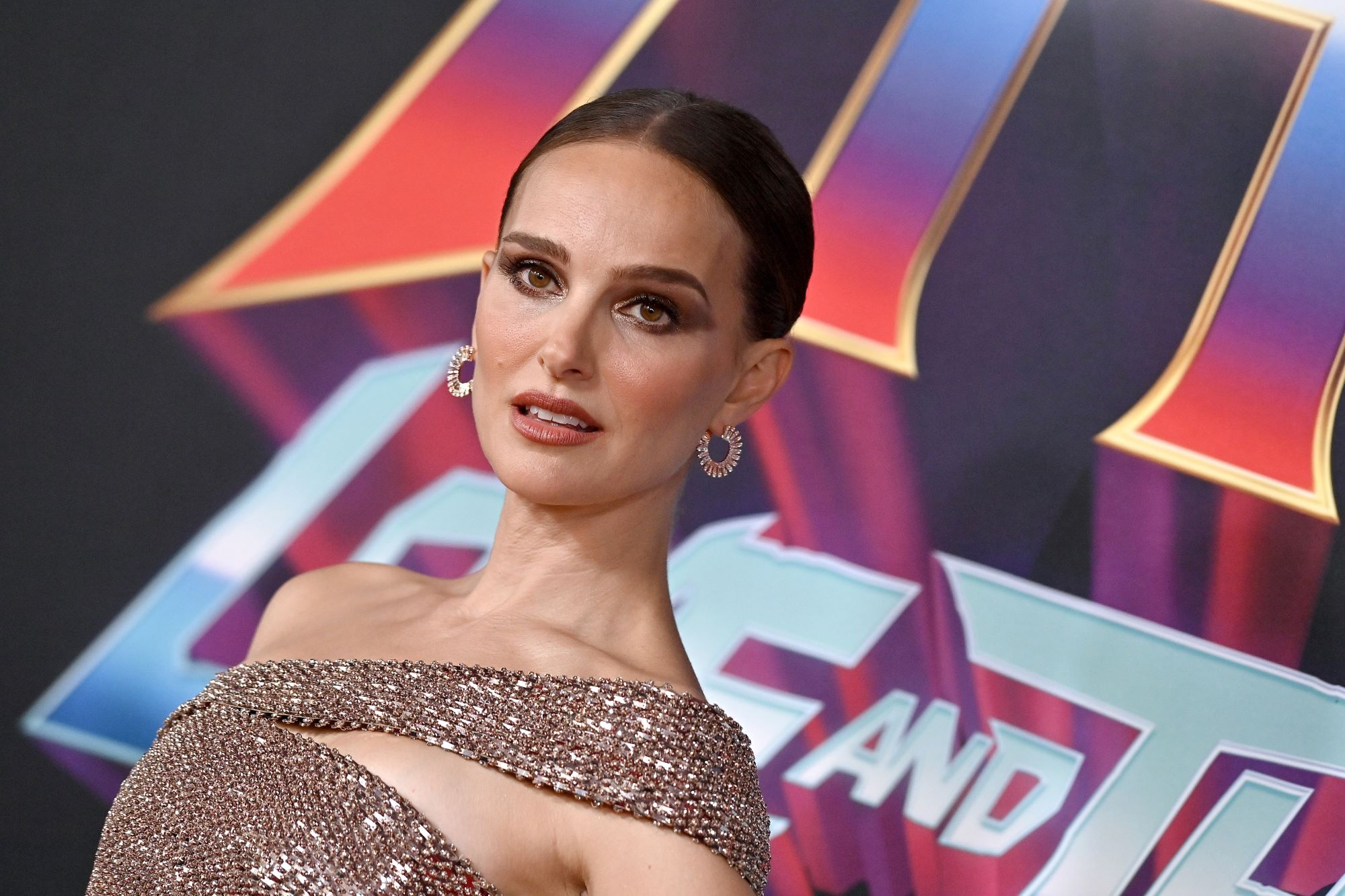 Natalie Portman, who may appear in a 'Thor: Love and Thunder' deleted scene, wears a beige sparkly dress.