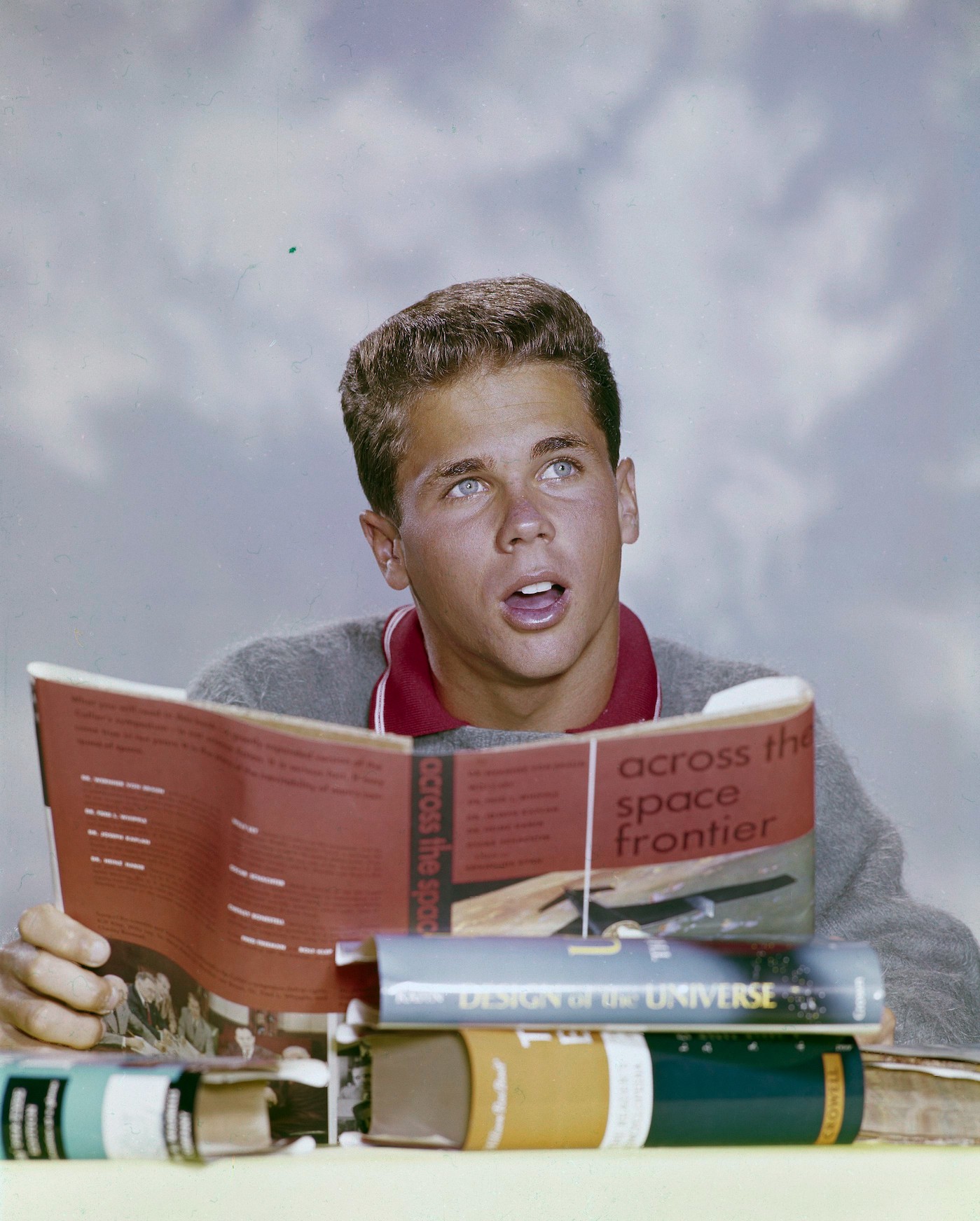 Tony Dow as Wally Cleaver reading a book and looking up in 'Leave It To Beaver' 