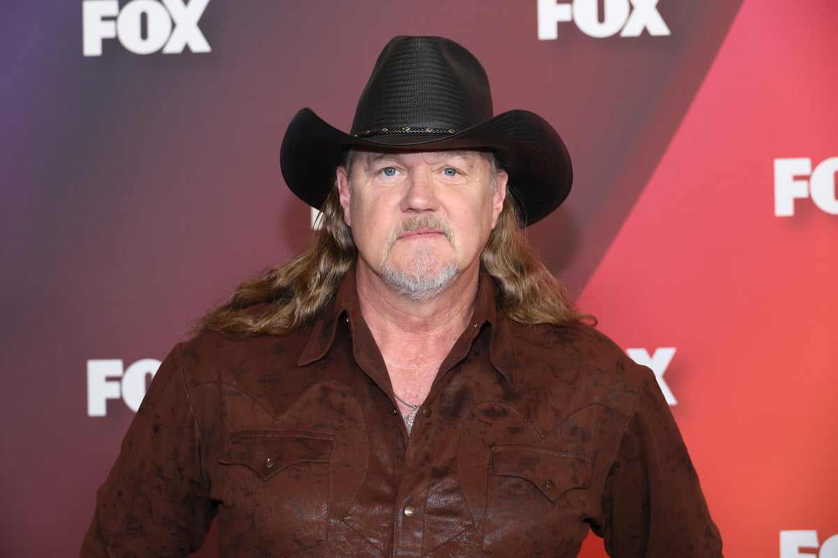 Trace Adkins attends the 2022 Fox Upfront event in a leather coat and black cowboy hat